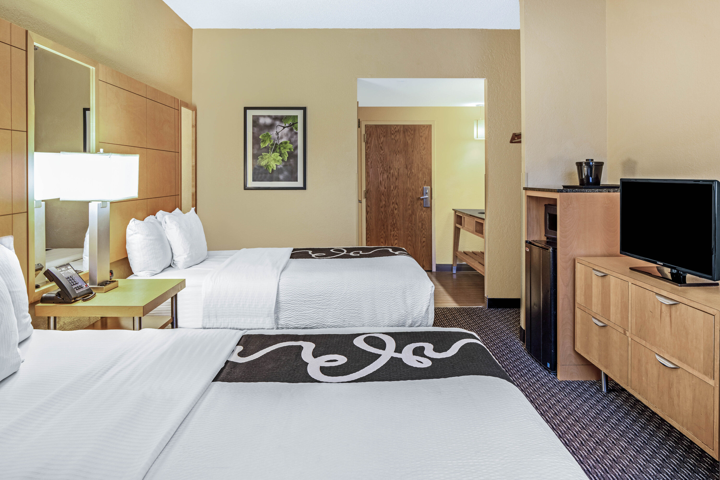 Guest room at the La Quinta Inn & Suites by Wyndham Naples Downtown in Naples, Florida