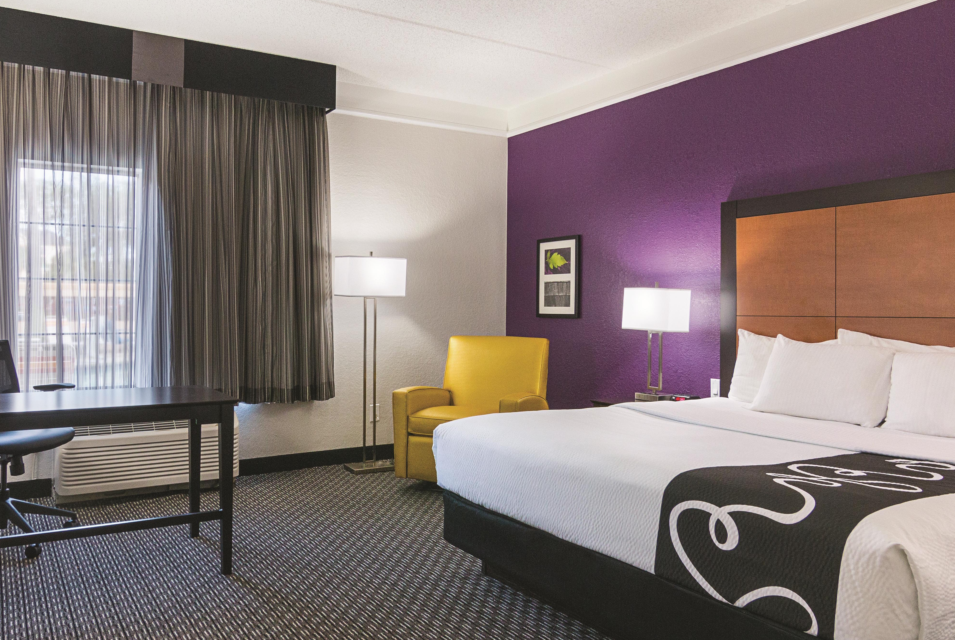 Guest room at the La Quinta Inn & Suites by Wyndham Orlando Airport in Orlando, Florida