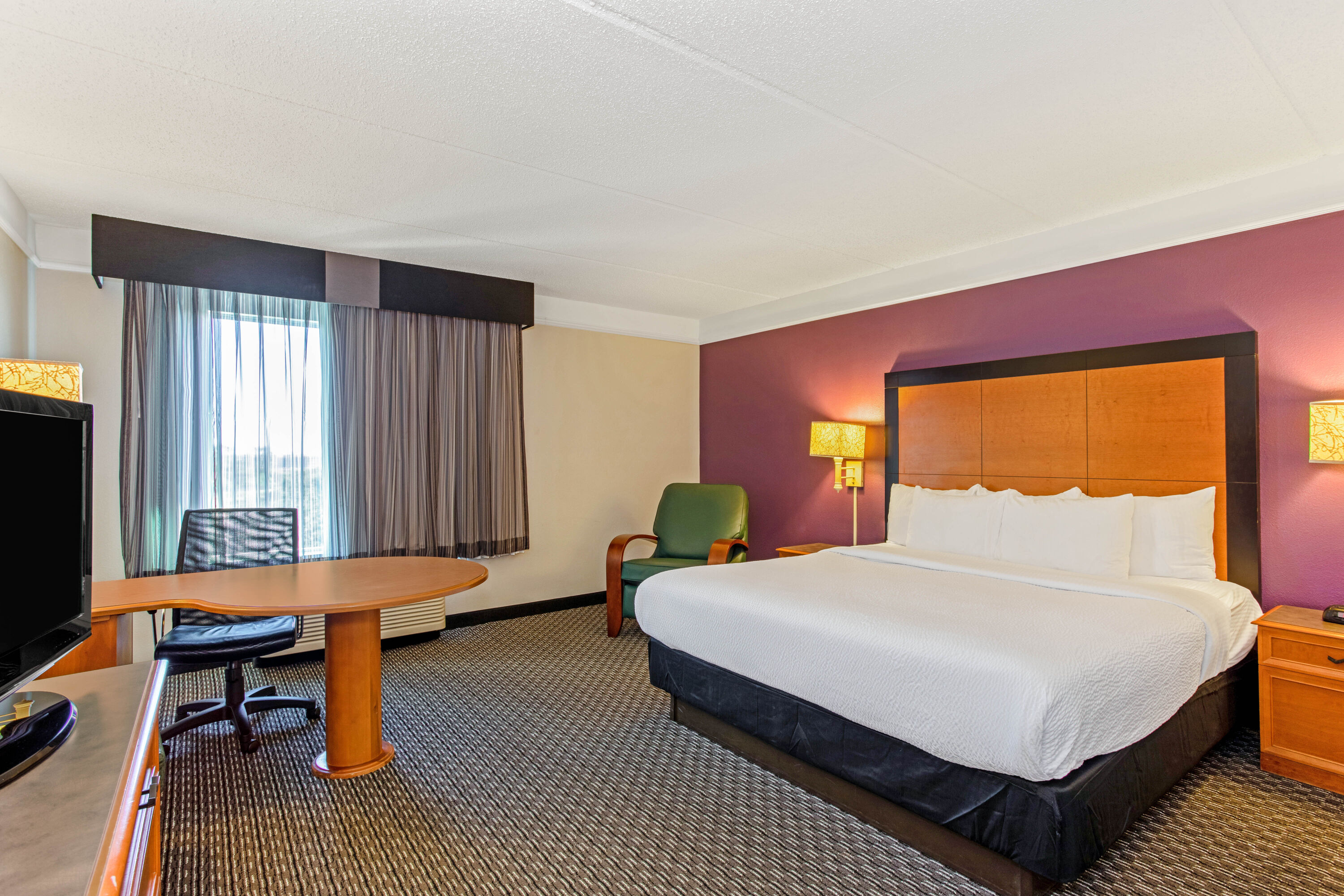 Guest room at the La Quinta Inn & Suites by Wyndham Orlando I Drive/Conv Ctr in Orlando, Florida
