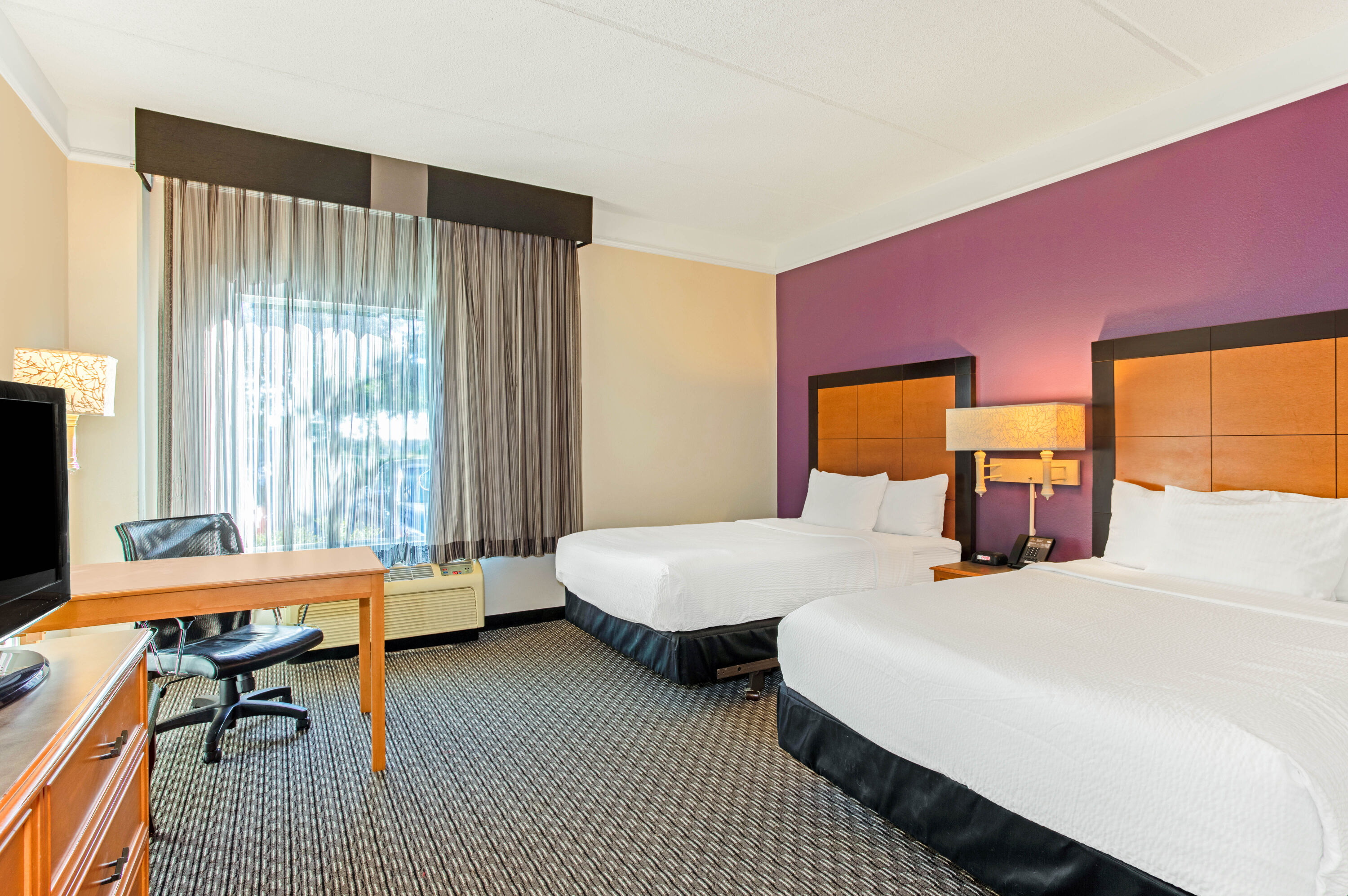 Guest room at the La Quinta Inn & Suites by Wyndham Orlando I Drive/Conv Ctr in Orlando, Florida