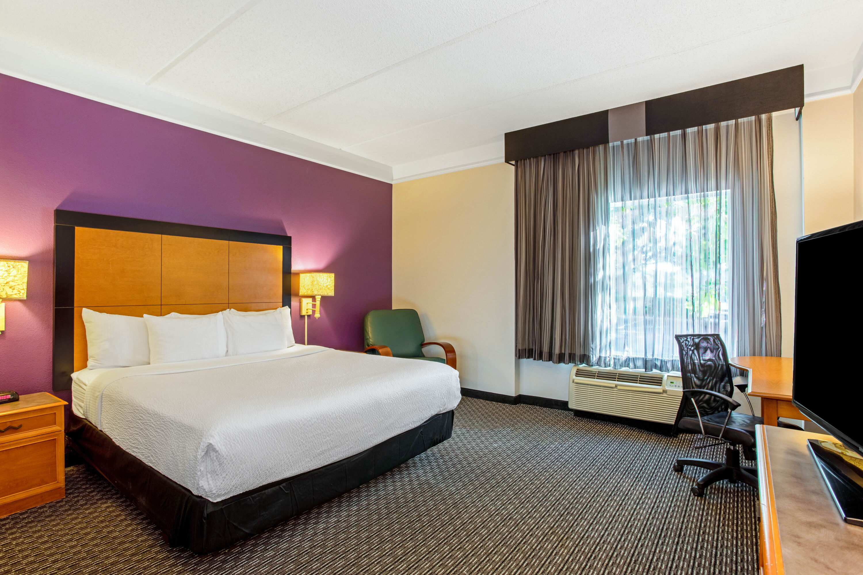 Guest room at the La Quinta Inn & Suites by Wyndham Orlando I Drive/Conv Ctr in Orlando, Florida
