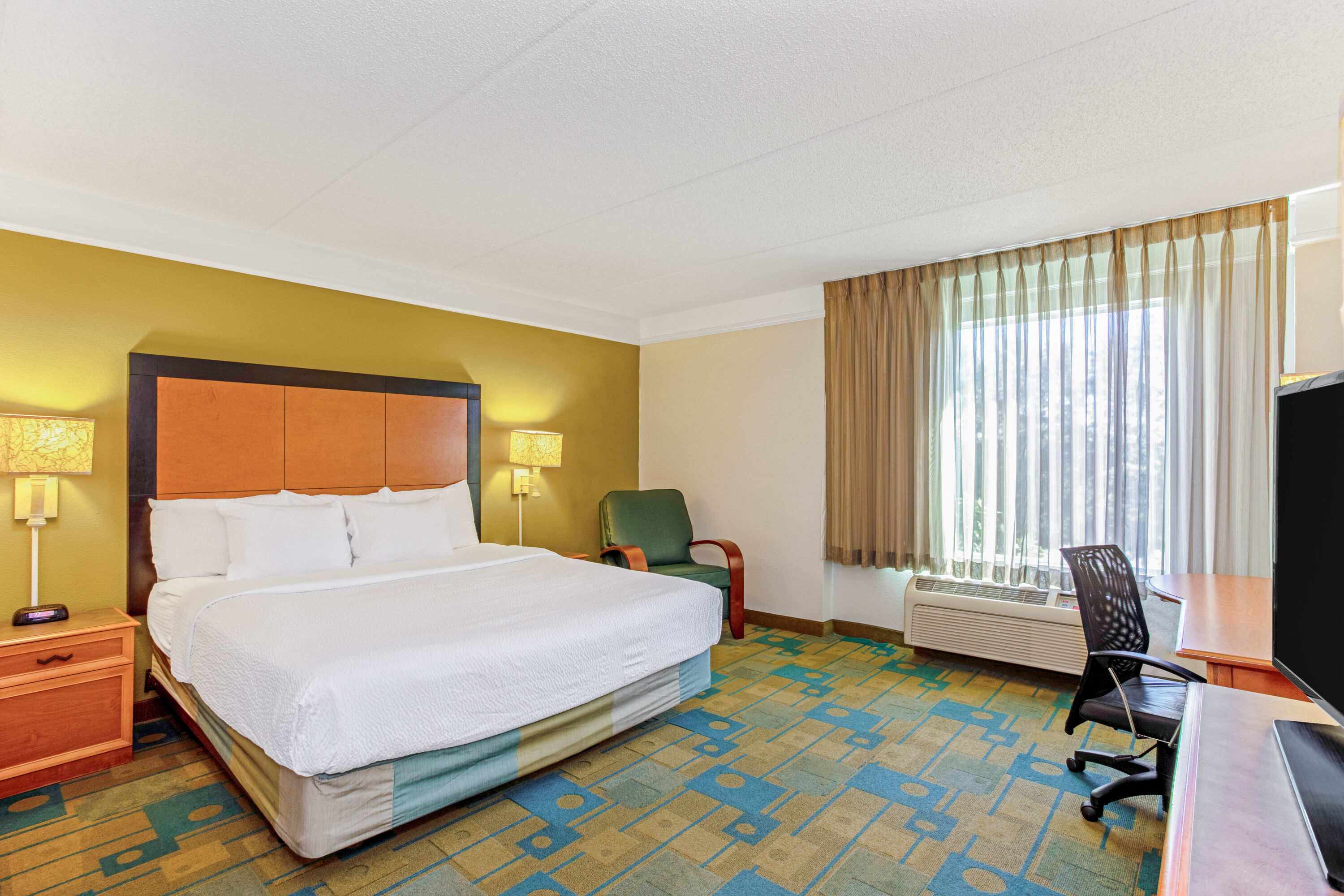 Guest room at the La Quinta Inn & Suites by Wyndham Orlando I Drive/Conv Ctr in Orlando, Florida