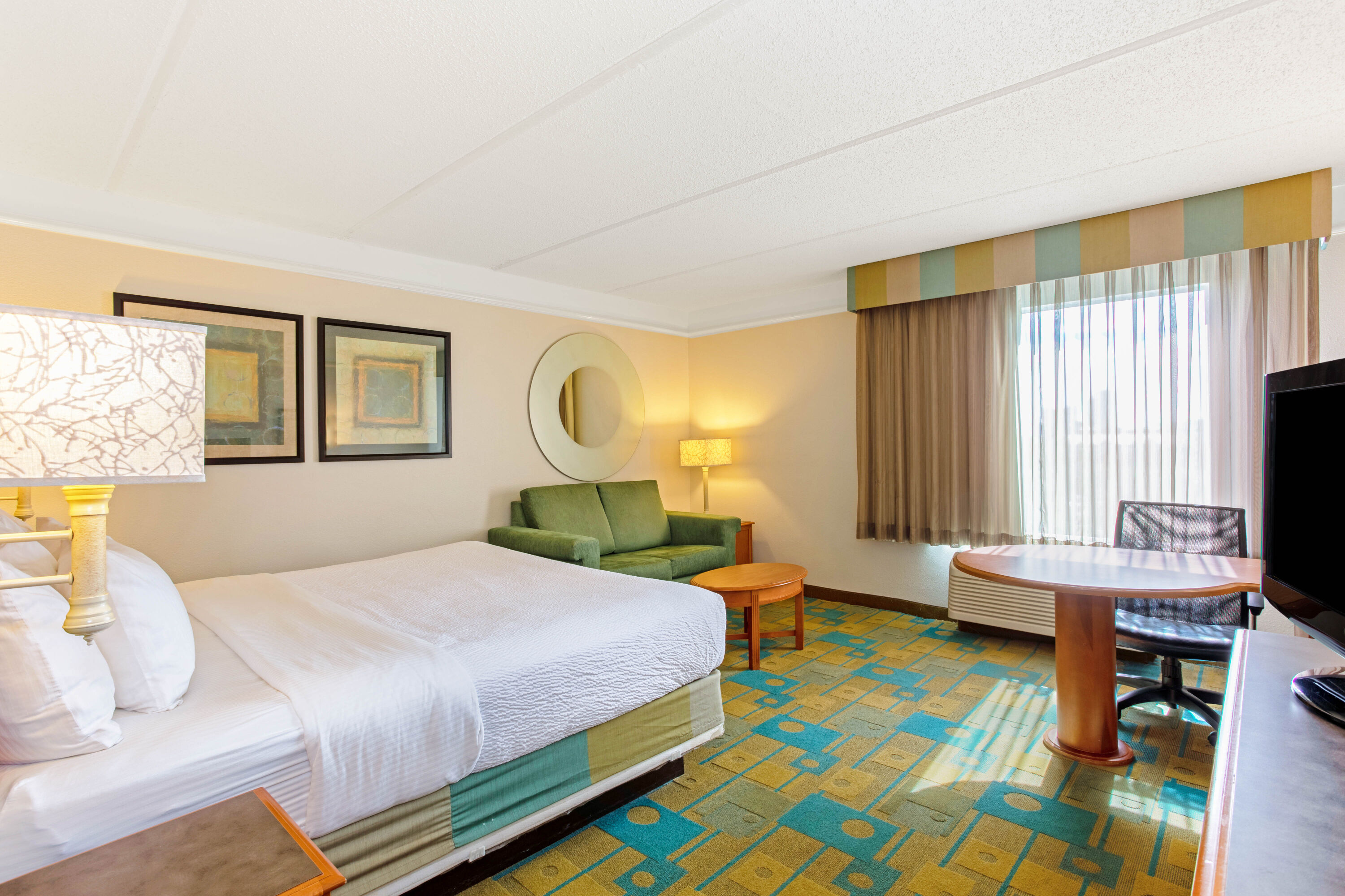 Guest room at the La Quinta Inn & Suites by Wyndham Orlando I Drive/Conv Ctr in Orlando, Florida