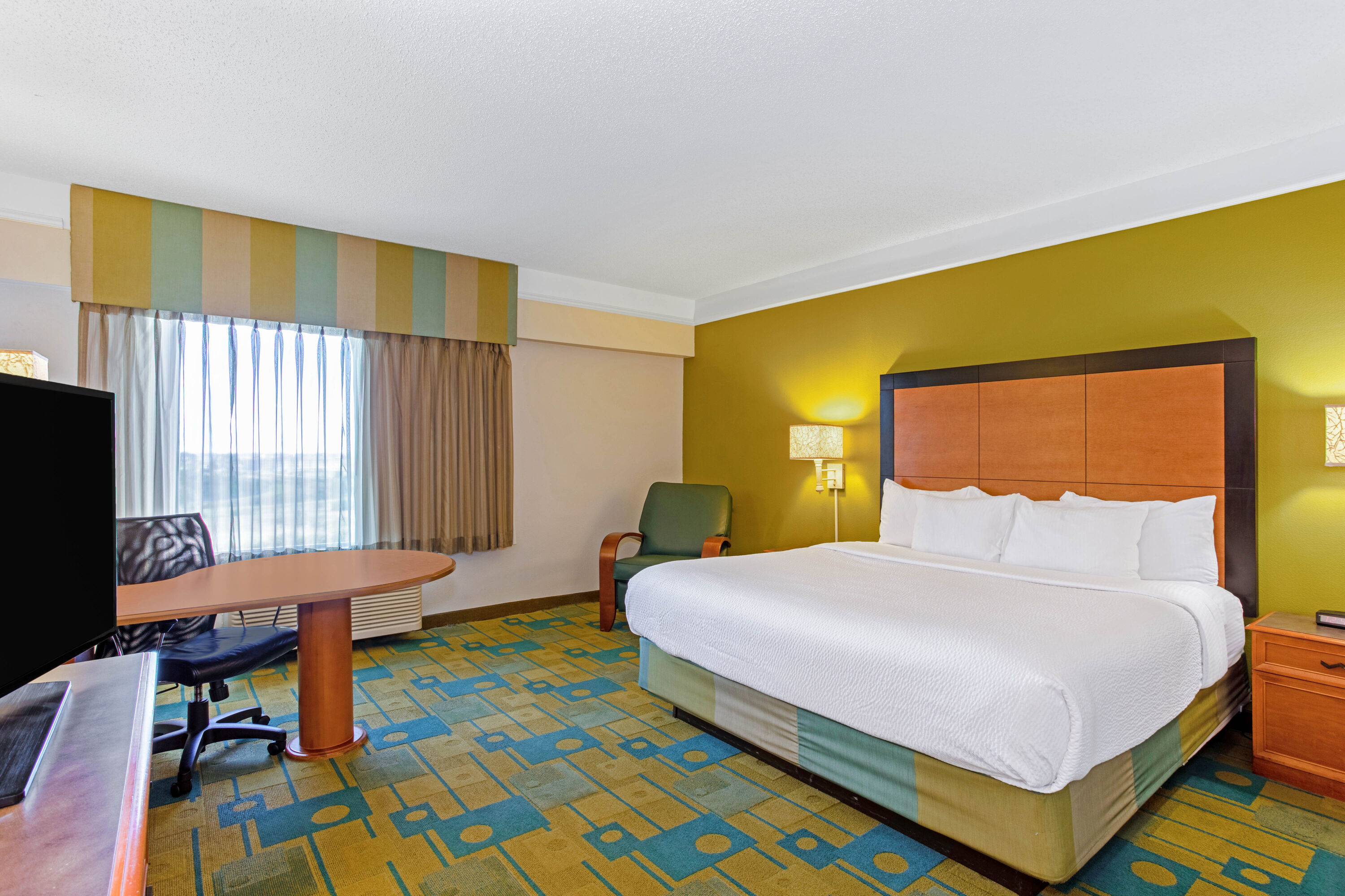 Guest room at the La Quinta Inn & Suites by Wyndham Orlando I Drive/Conv Ctr in Orlando, Florida