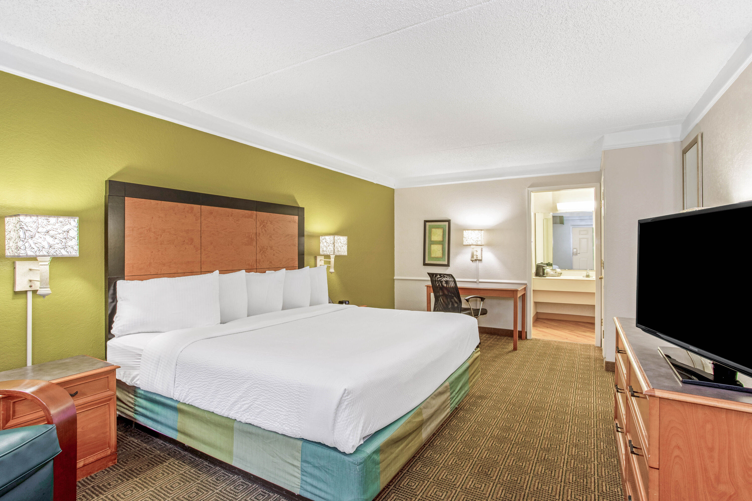 Guest room at the La Quinta Inn by Wyndham Orlando Airport West in Orlando, Florida