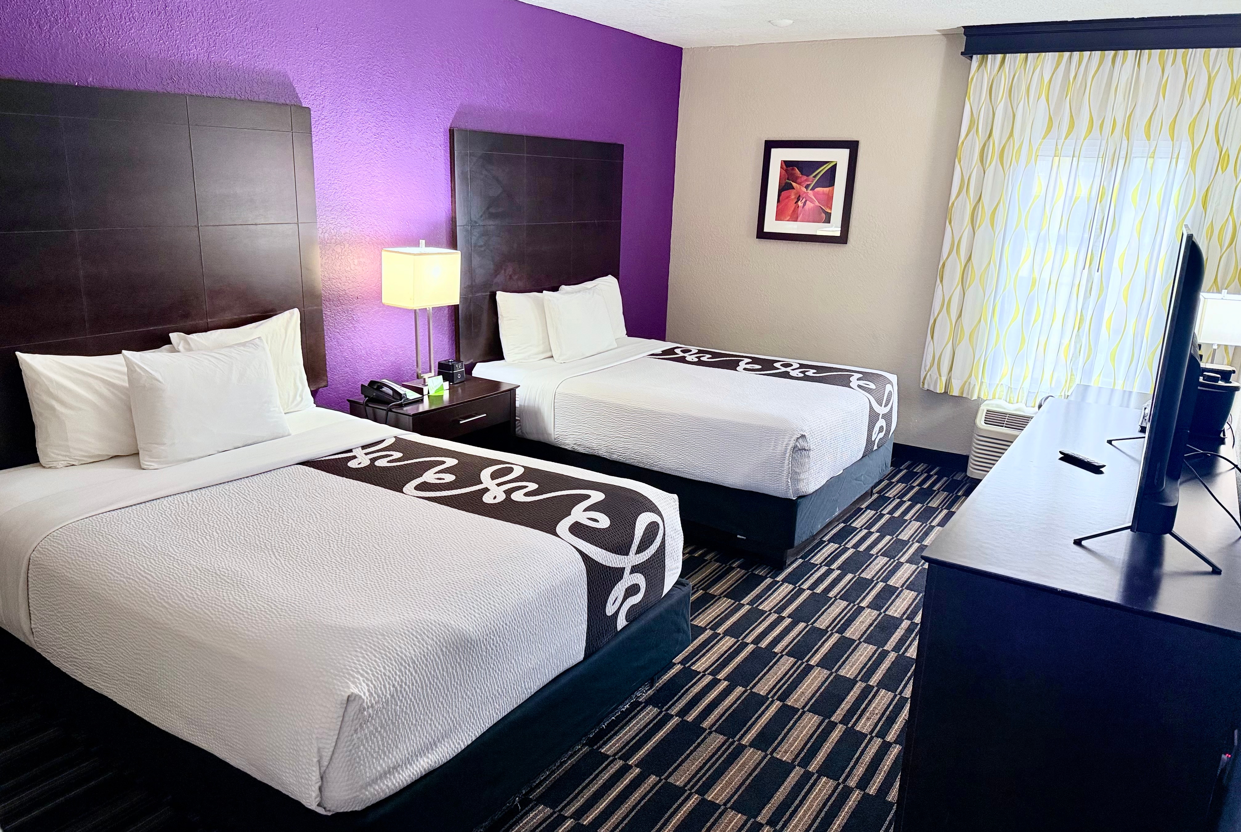 Guest room at the La Quinta Inn & Suites by Wyndham Orlando Universal area in Orlando, Florida