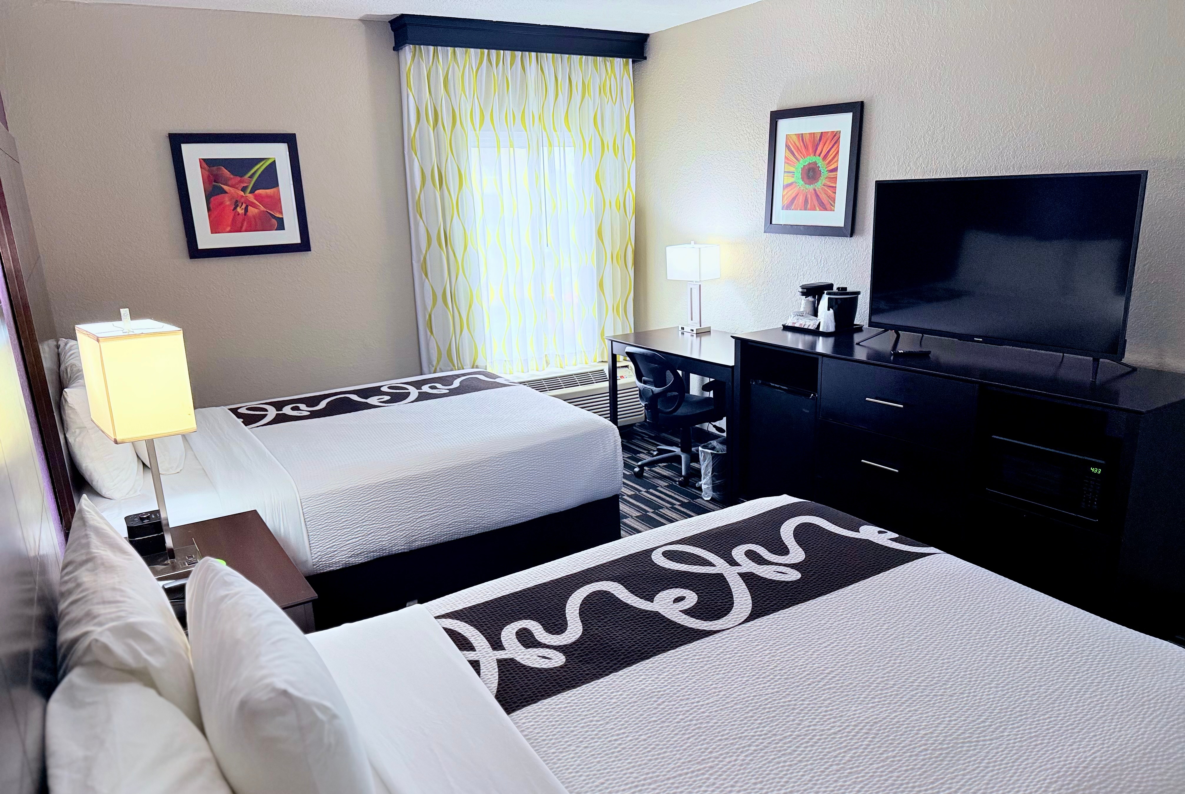 Guest room at the La Quinta Inn & Suites by Wyndham Orlando Universal area in Orlando, Florida