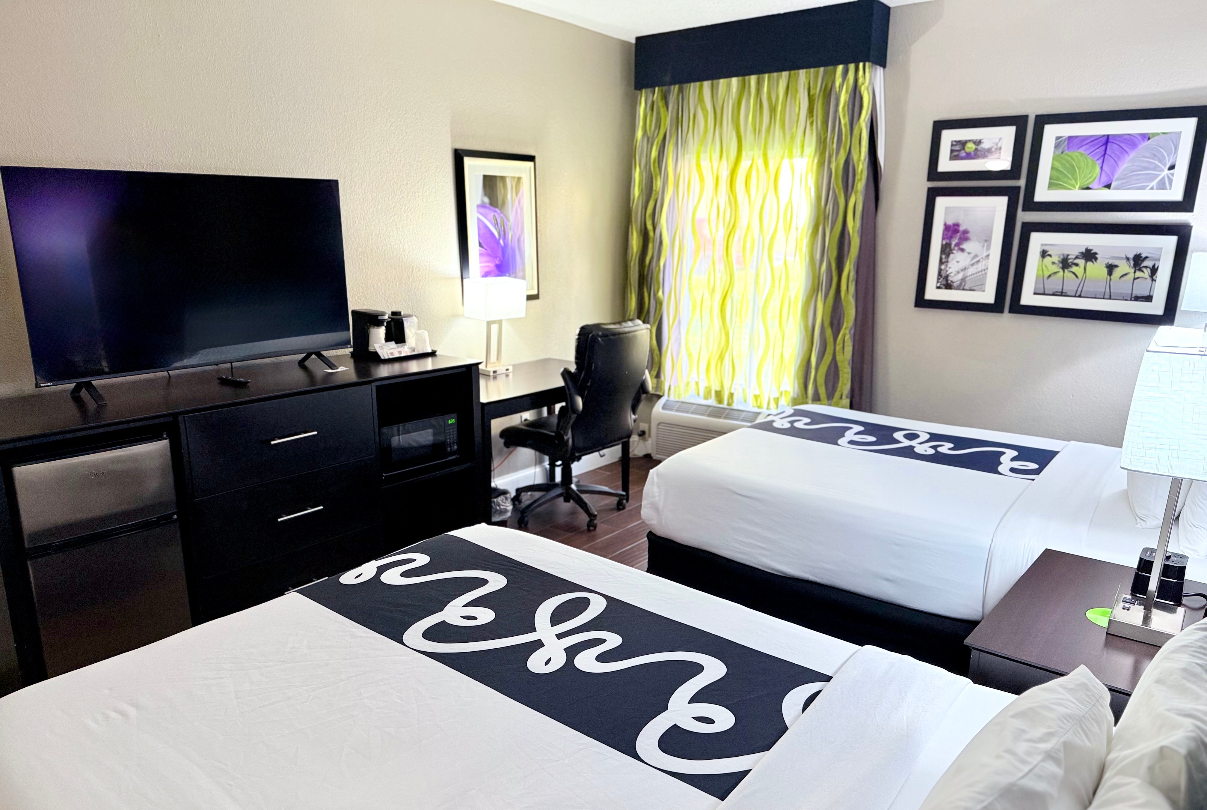 Guest room at the La Quinta Inn & Suites by Wyndham Orlando Universal area in Orlando, Florida