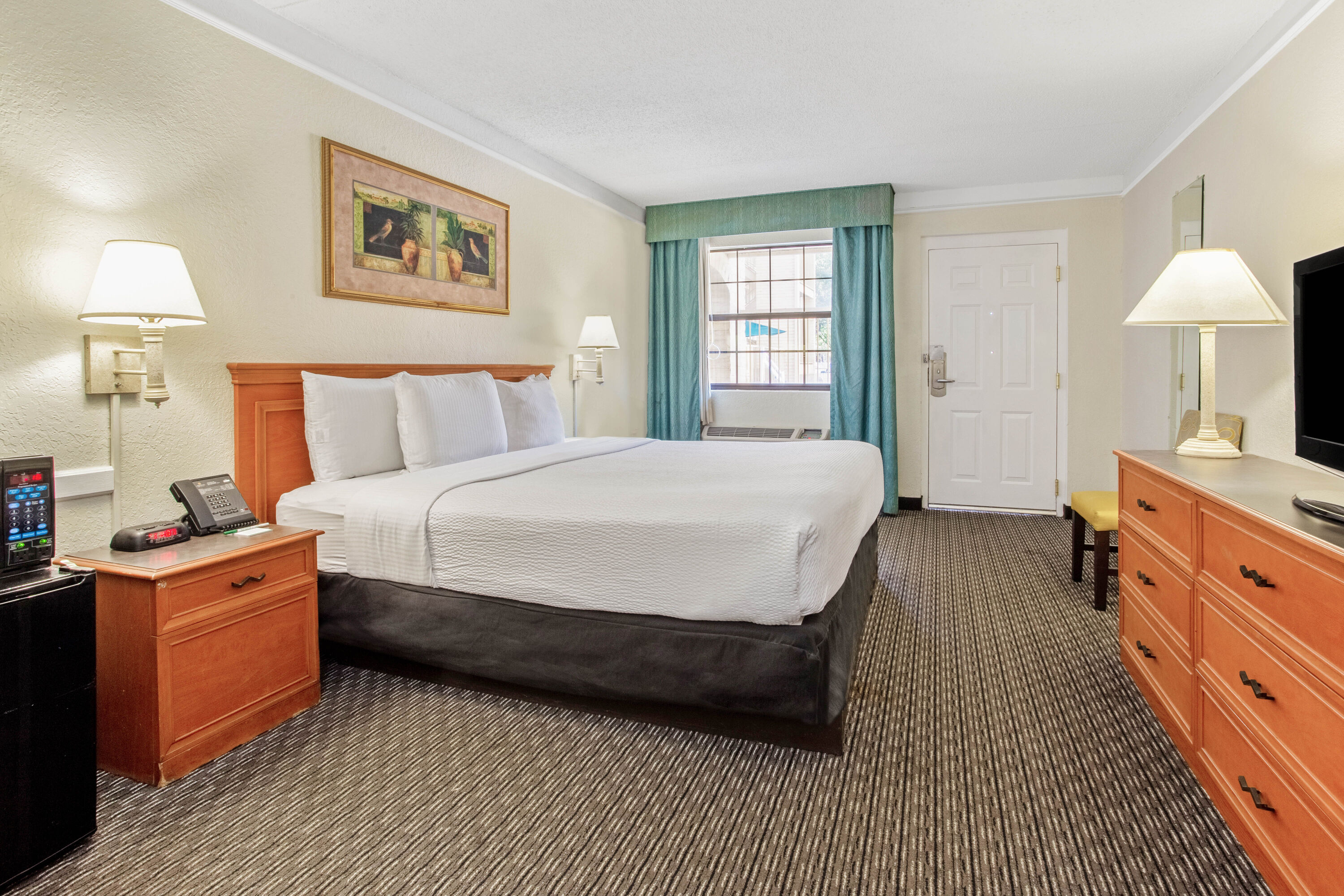 Guest room at the La Quinta Inn by Wyndham Tampa Bay Pinellas Park Clearwater in Pinellas Park, Florida