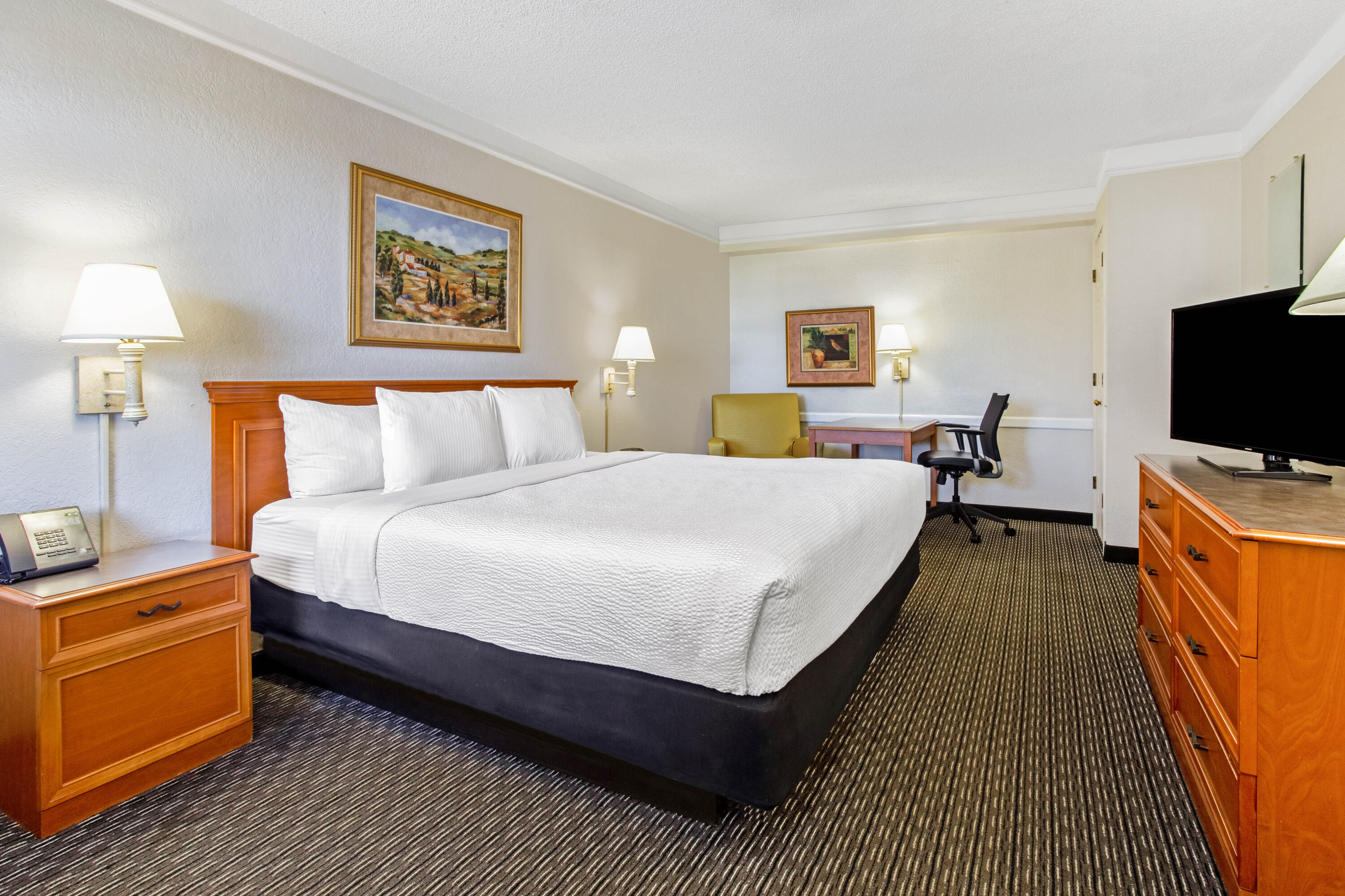 Guest room at the La Quinta Inn by Wyndham Tampa Bay Pinellas Park Clearwater in Pinellas Park, Florida