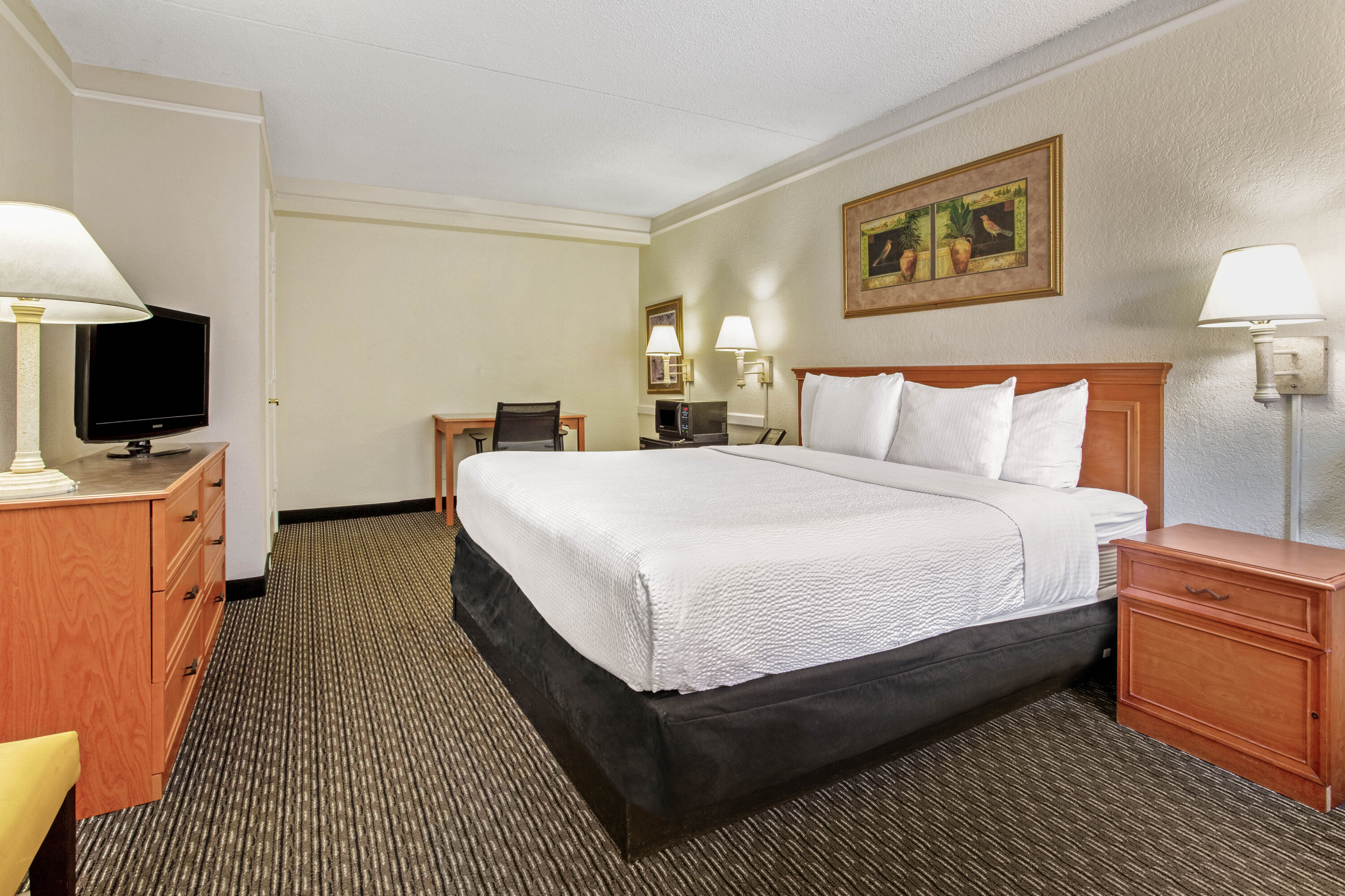 Guest room at the La Quinta Inn by Wyndham Tampa Bay Pinellas Park Clearwater in Pinellas Park, Florida