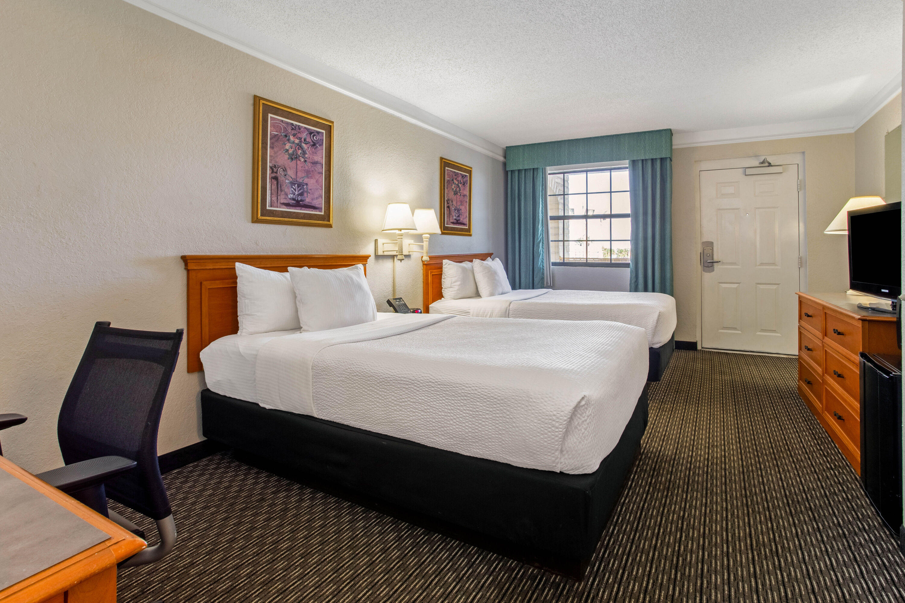 Guest room at the La Quinta Inn by Wyndham Tampa Bay Pinellas Park Clearwater in Pinellas Park, Florida