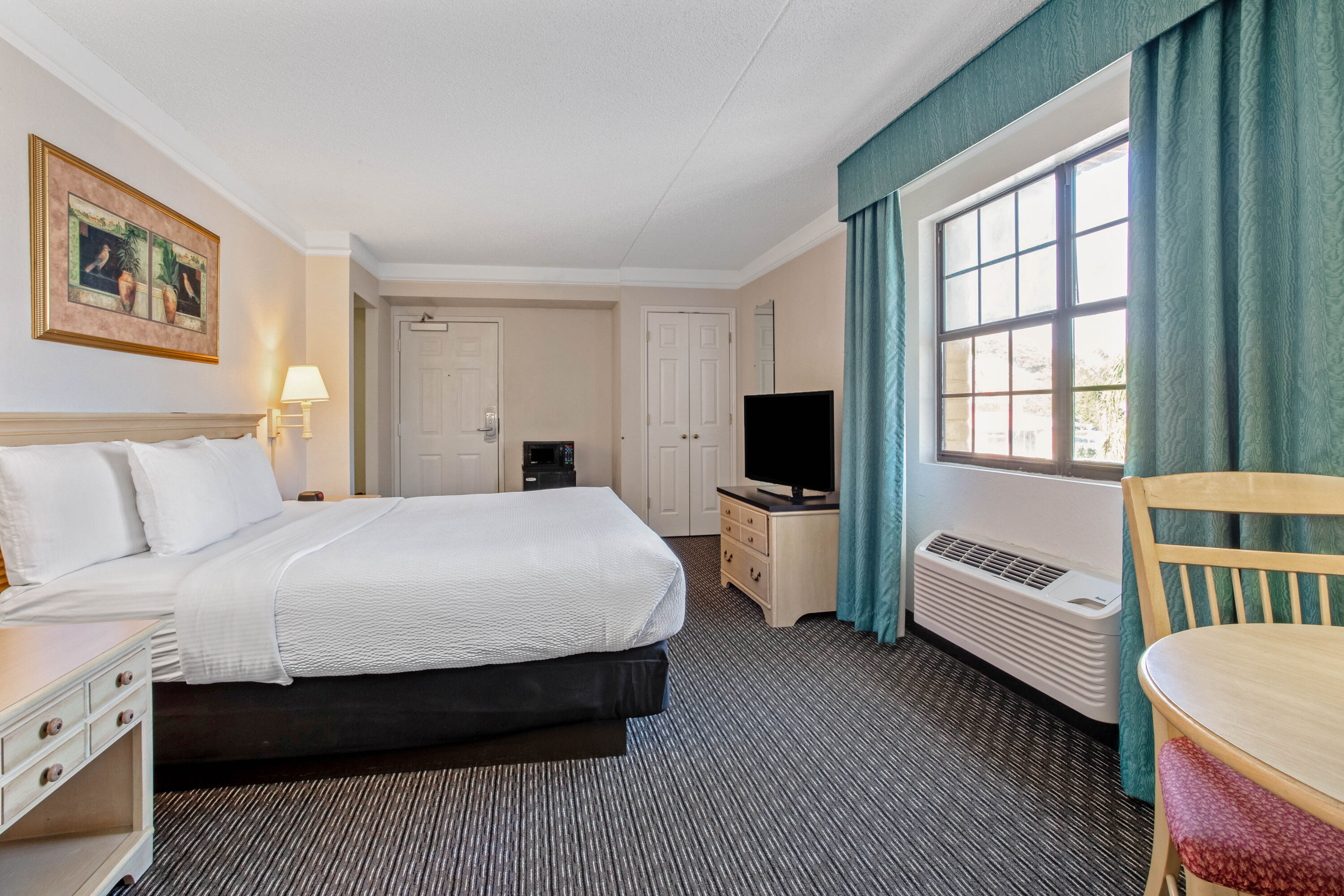 Guest room at the La Quinta Inn by Wyndham Tampa Bay Pinellas Park Clearwater in Pinellas Park, Florida