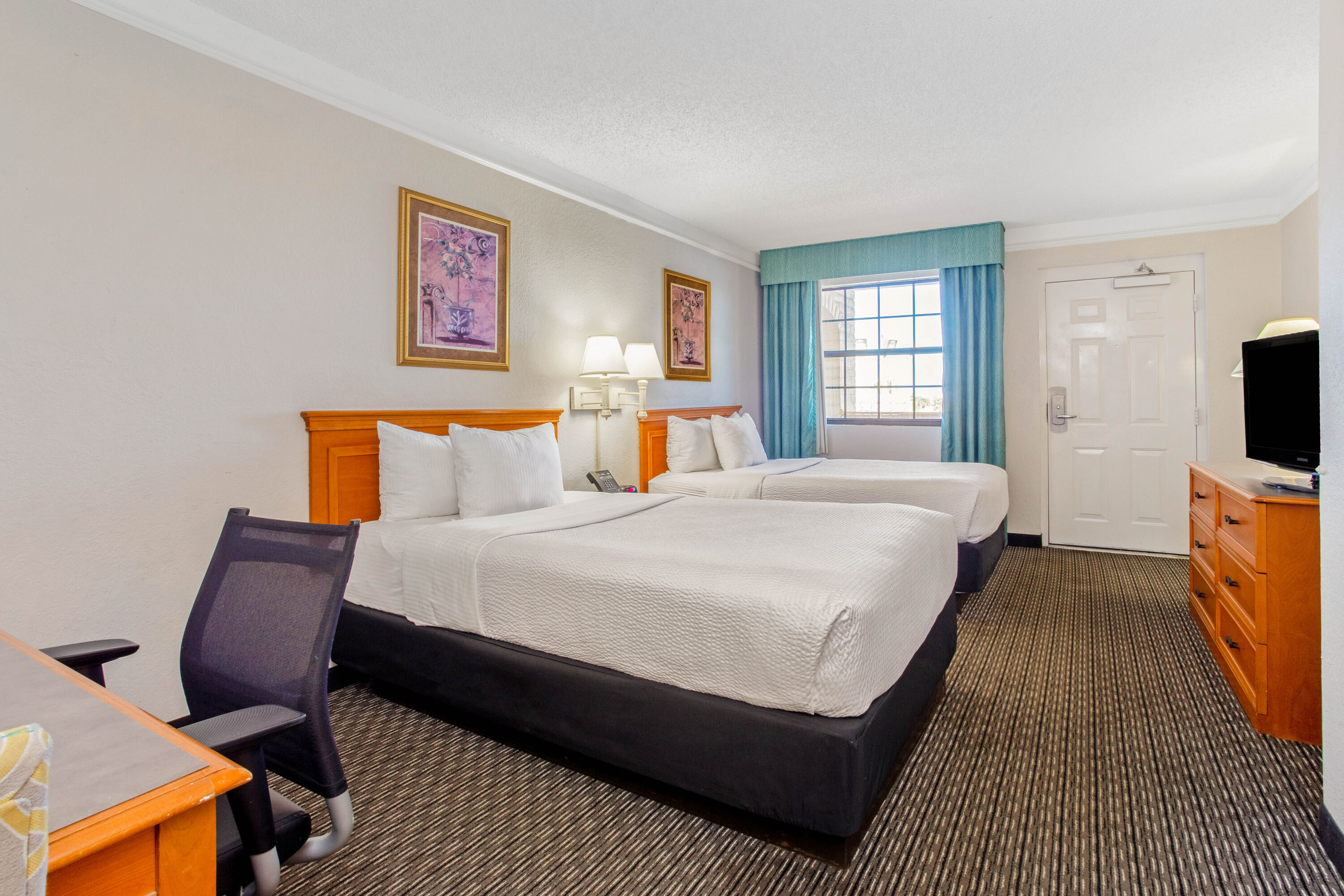Guest room at the La Quinta Inn by Wyndham Tampa Bay Pinellas Park Clearwater in Pinellas Park, Florida