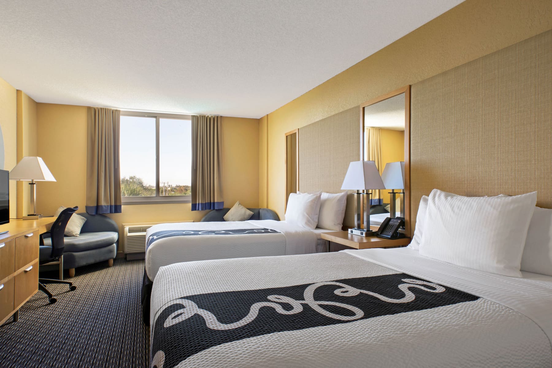 Guest room at the La Quinta Inn & Suites by Wyndham Sunrise in Sunrise, Florida