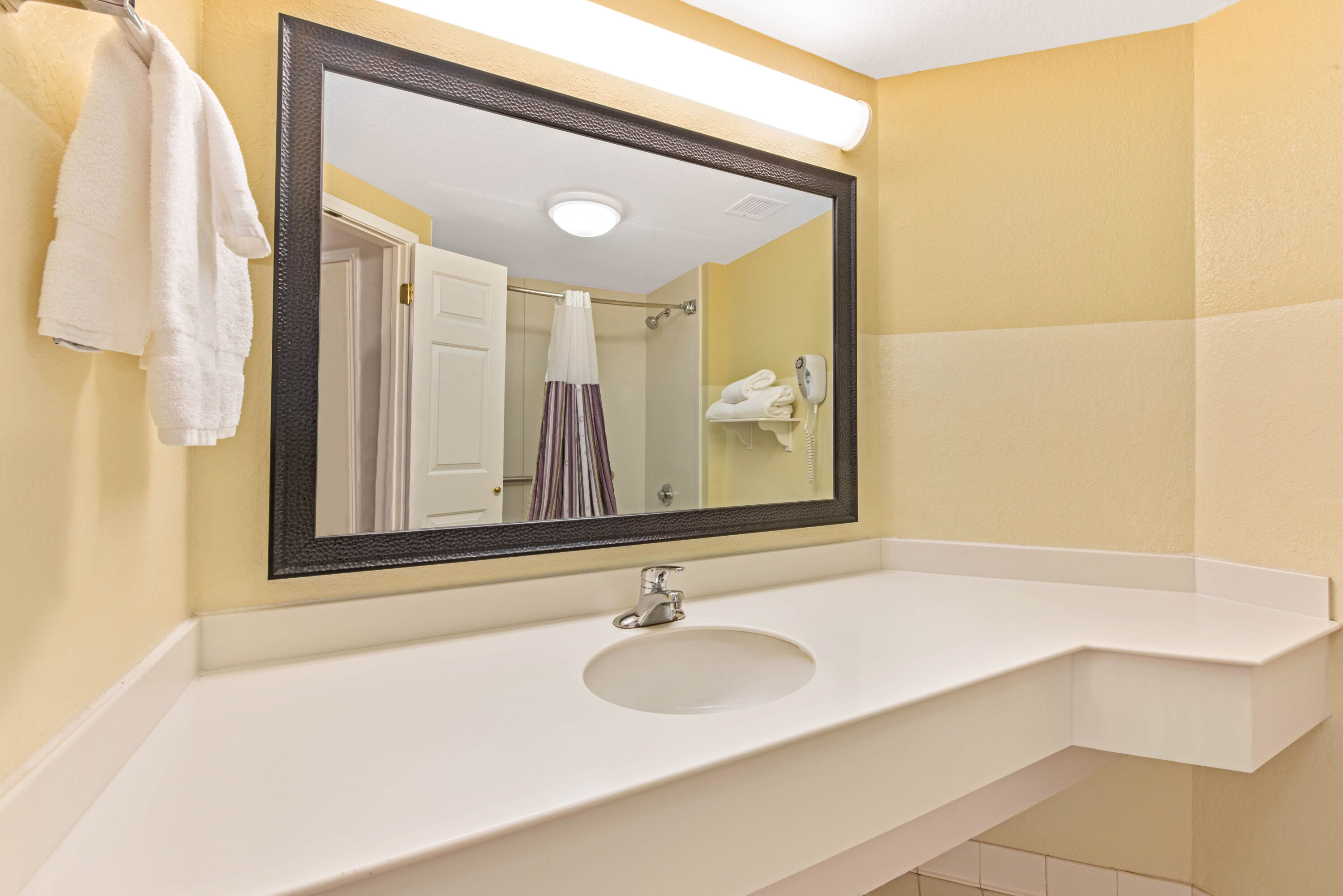 Guest room bath at the La Quinta Inn & Suites by Wyndham USF (Near Busch Gardens) in Tampa, Florida