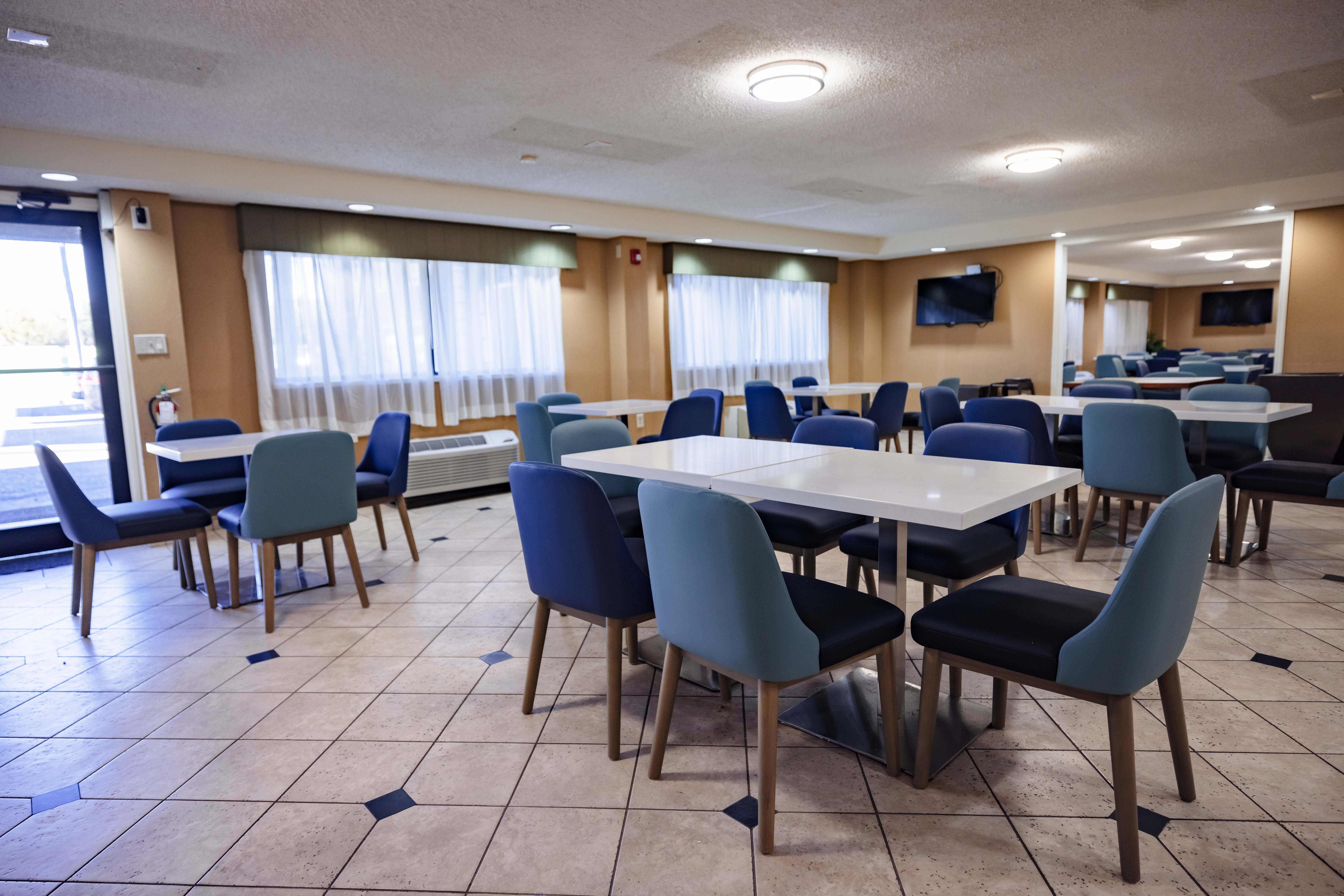 La Quinta Inn by Wyndham Tampa Near Busch Gardens restaurant breakfast area with seating in Tampa, Florida