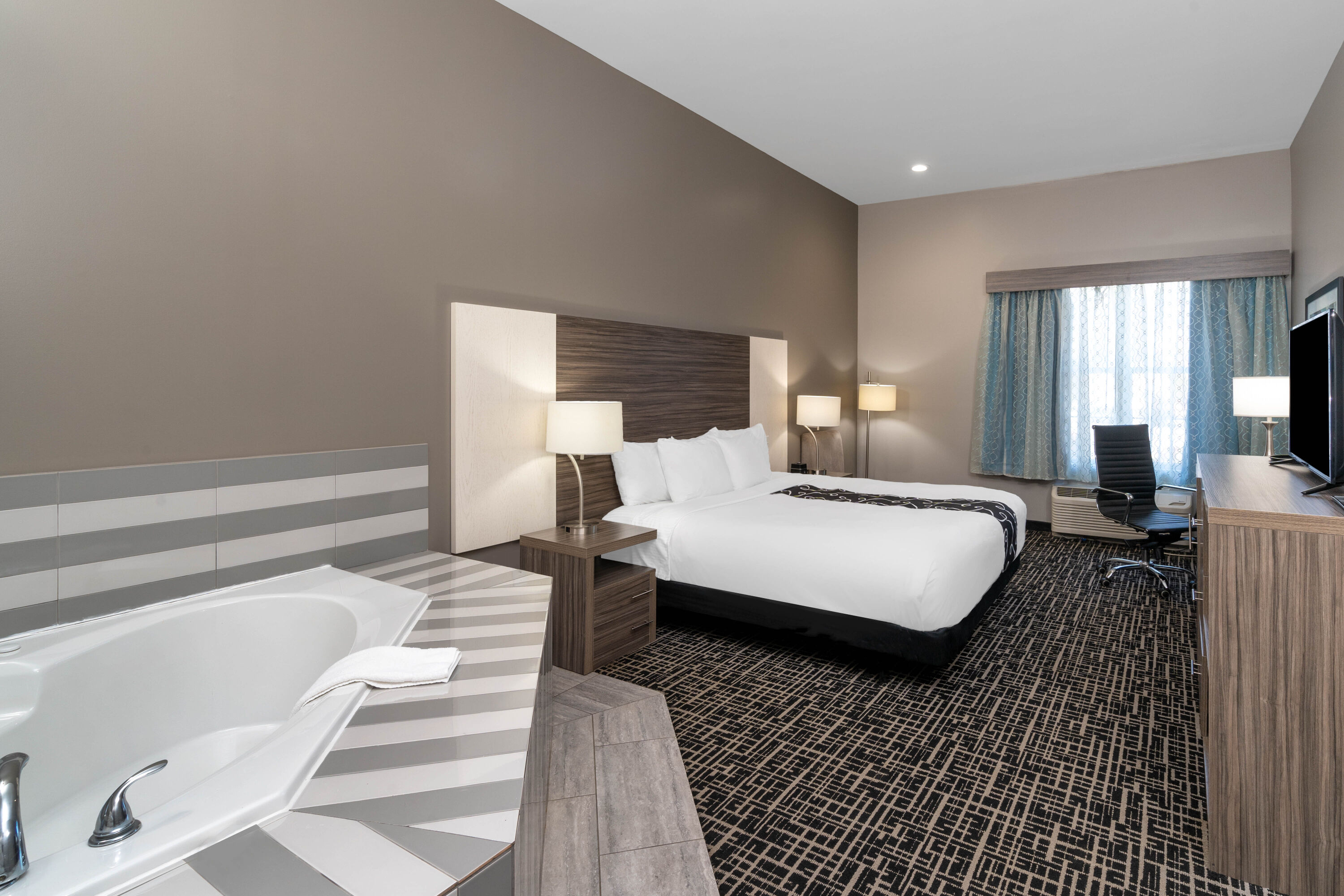 Guest room at the La Quinta Inn & Suites by Wyndham Forsyth in Forsyth, Georgia