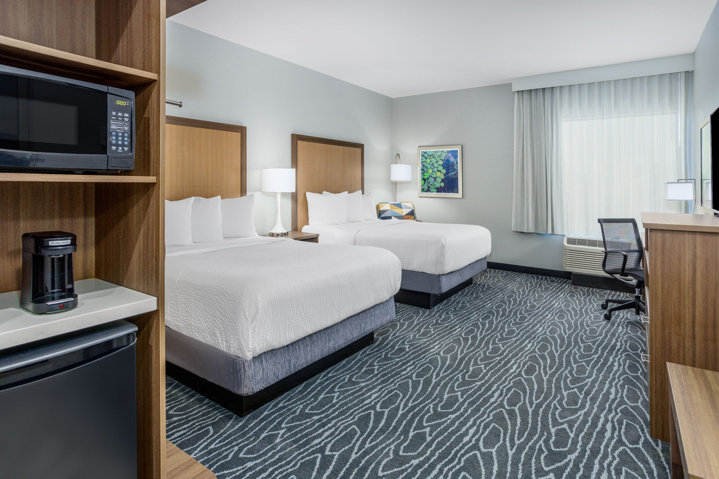 Guest room at the La Quinta Inn & Suites by Wyndham Valdosta in Valdosta, Georgia