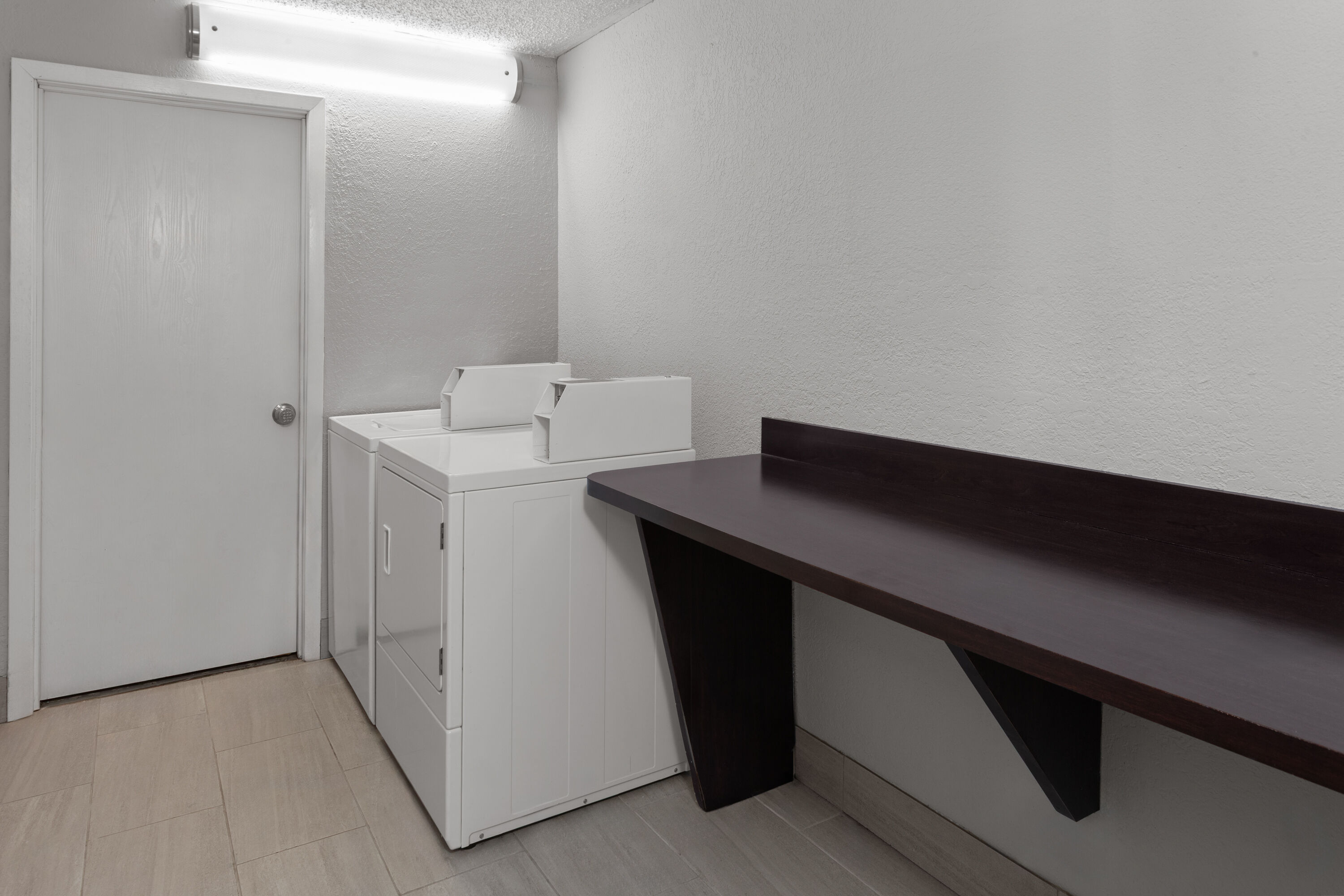 Laundry facilities at La Quinta Inn by Wyndham Champaign in Champaign, Illinois