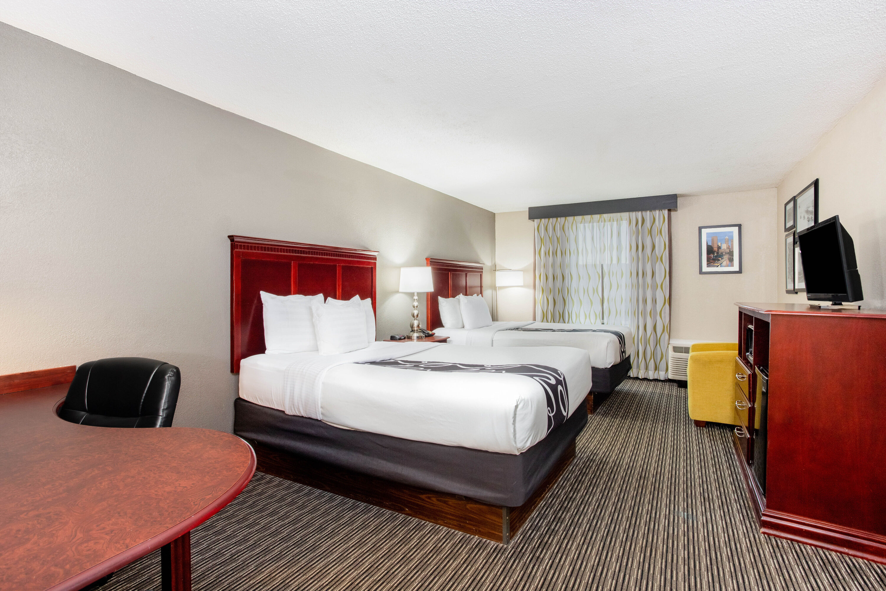 Guest room at the La Quinta Inn & Suites by Wyndham Indianapolis South in Indianapolis, Indiana