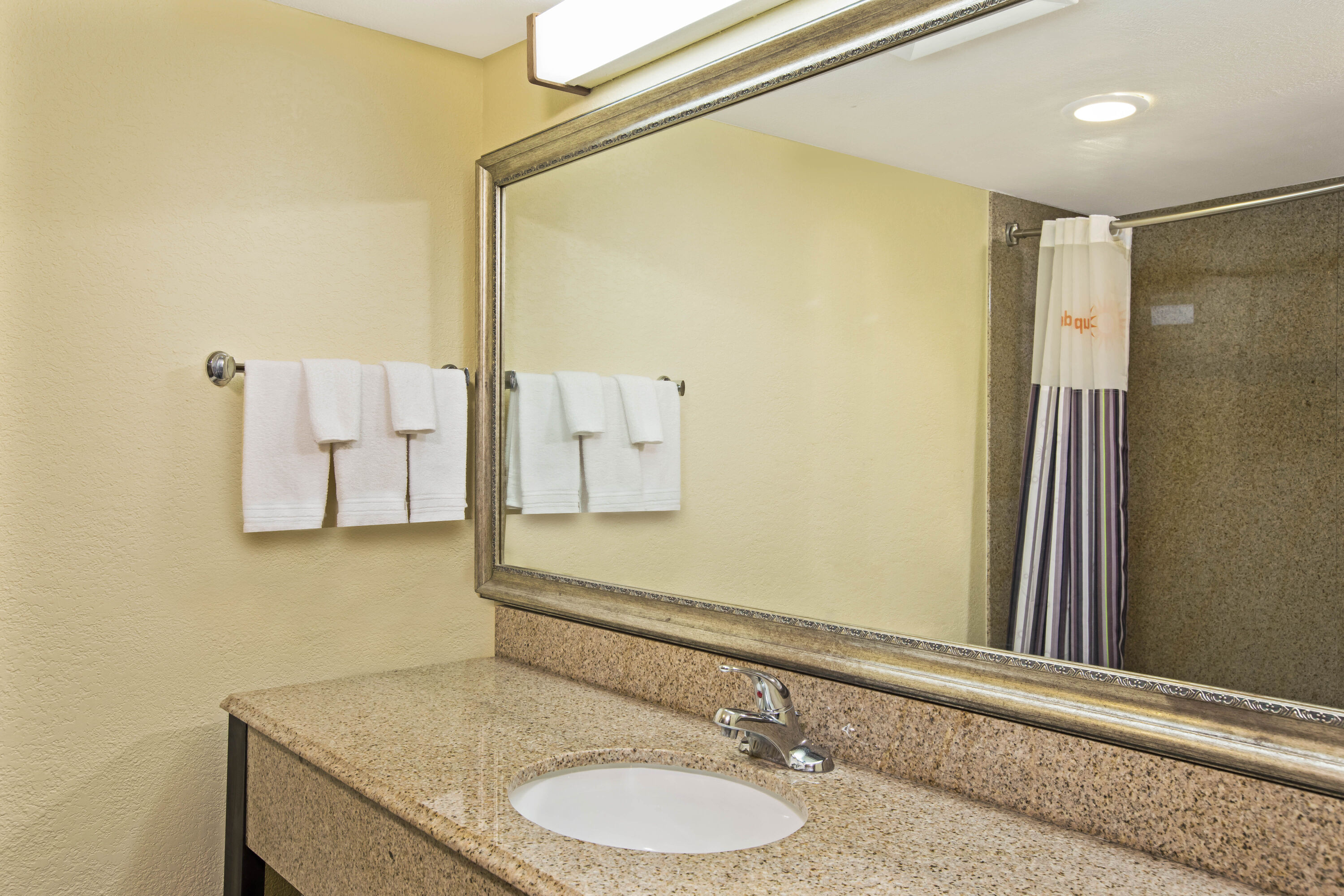 Guest room bath at the La Quinta Inn & Suites by Wyndham Salina in Salina, Kansas