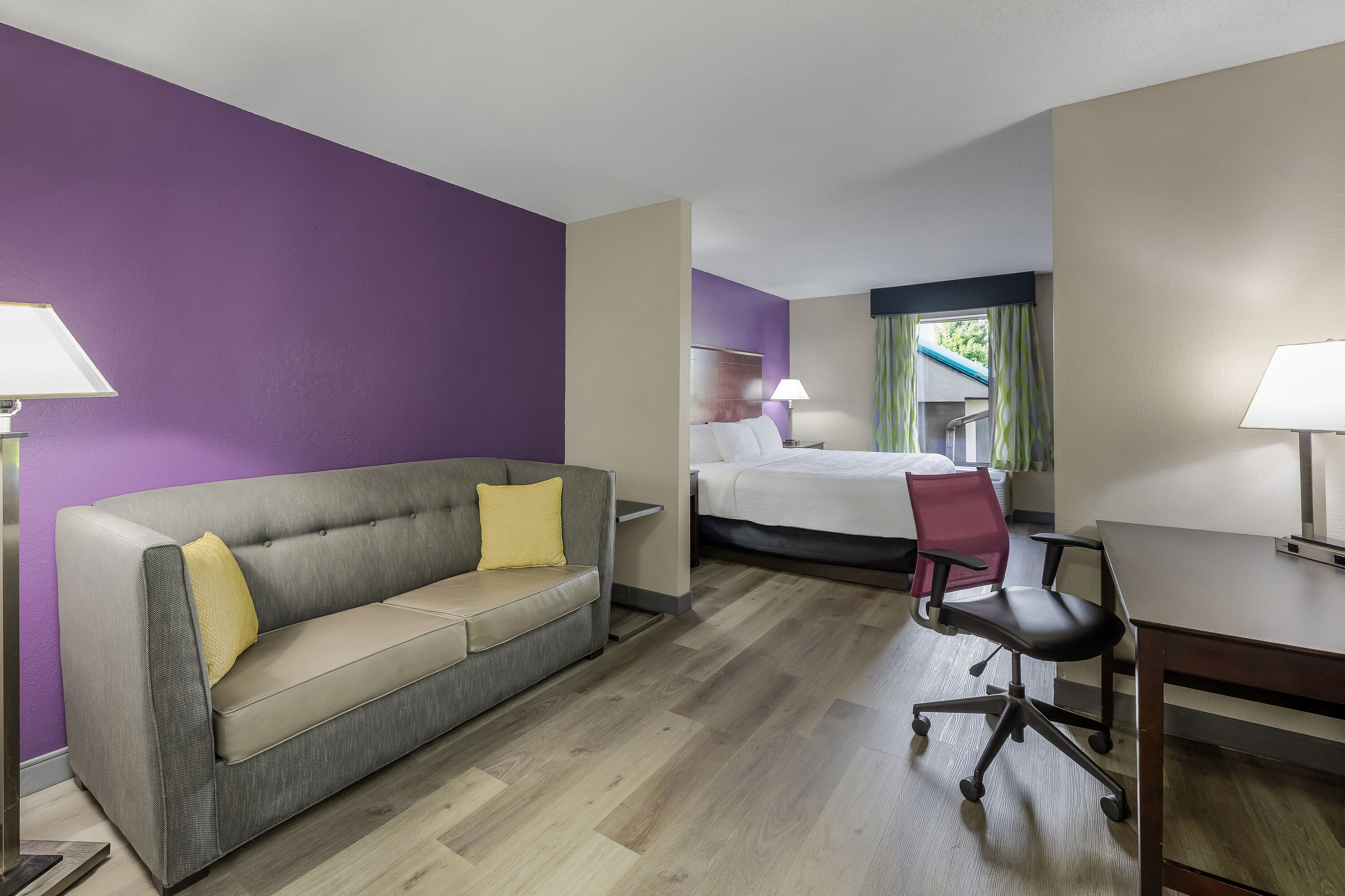 King bed guest room at the La Quinta Inn & Suites by Wyndham Louisville East in Louisville, Kentucky