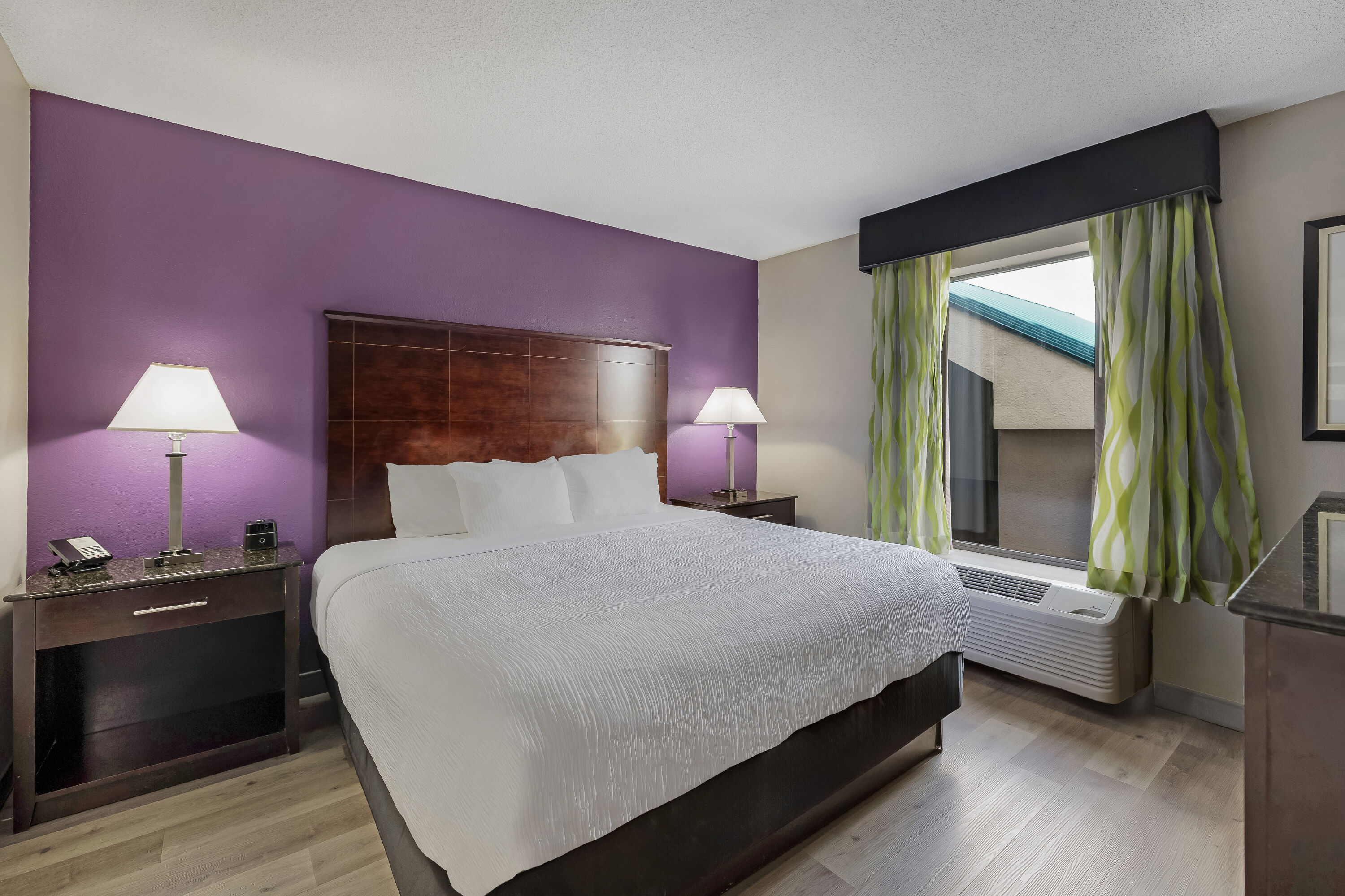 King bed guest room at the La Quinta Inn & Suites by Wyndham Louisville East in Louisville, Kentucky