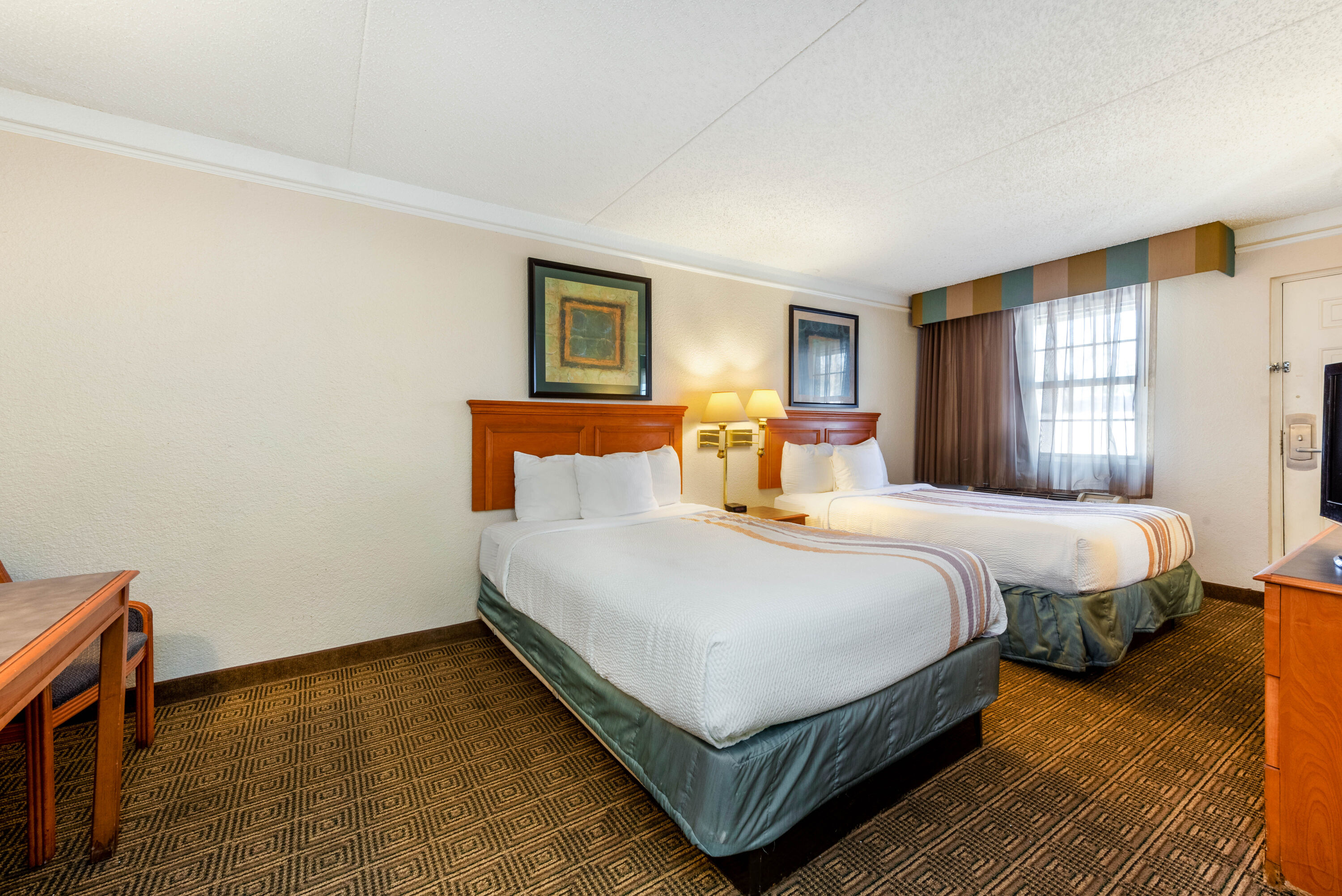 Guest room at the La Quinta Inn by Wyndham Bossier City in Bossier City, Louisiana