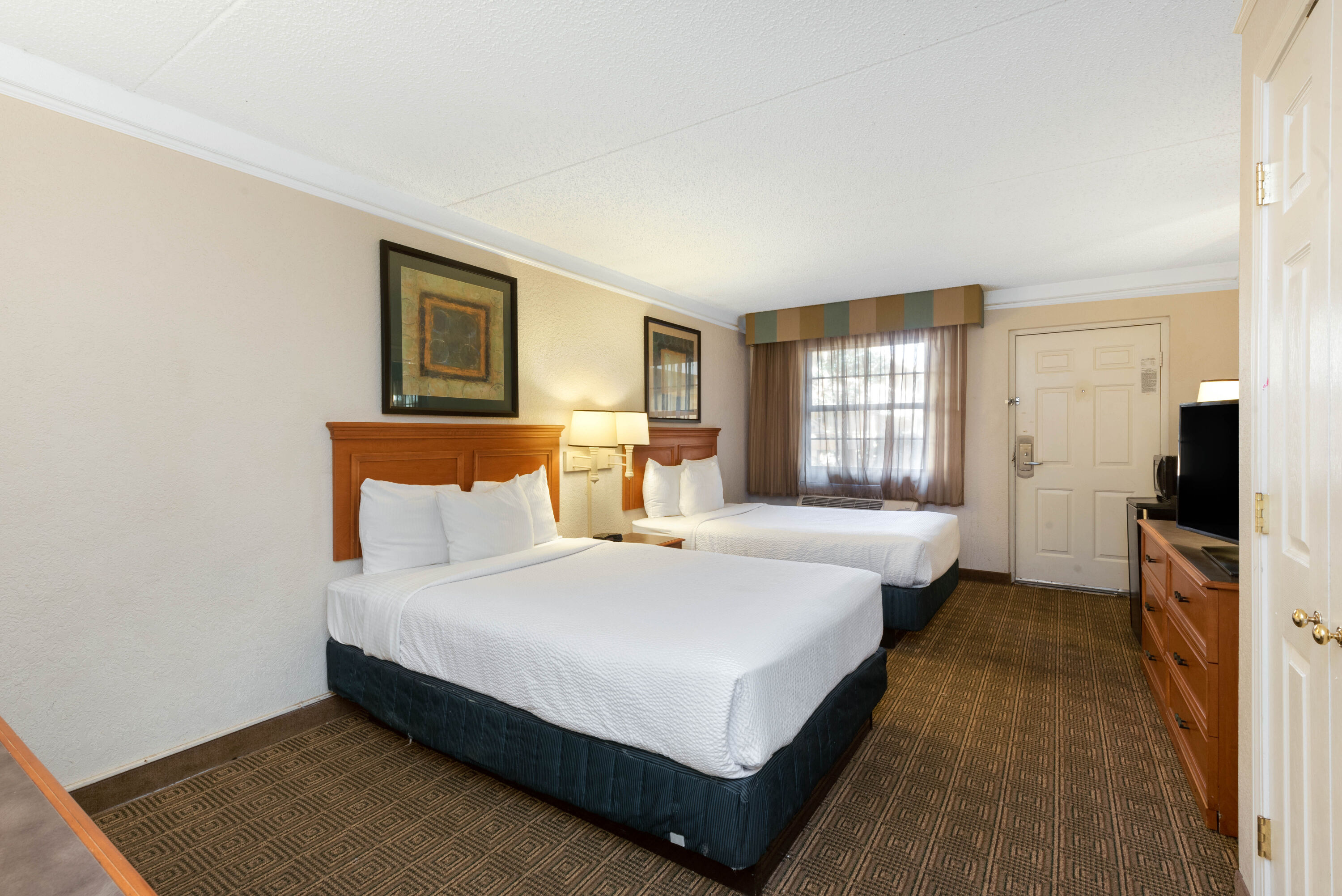 Guest room at the La Quinta Inn by Wyndham Bossier City in Bossier City, Louisiana