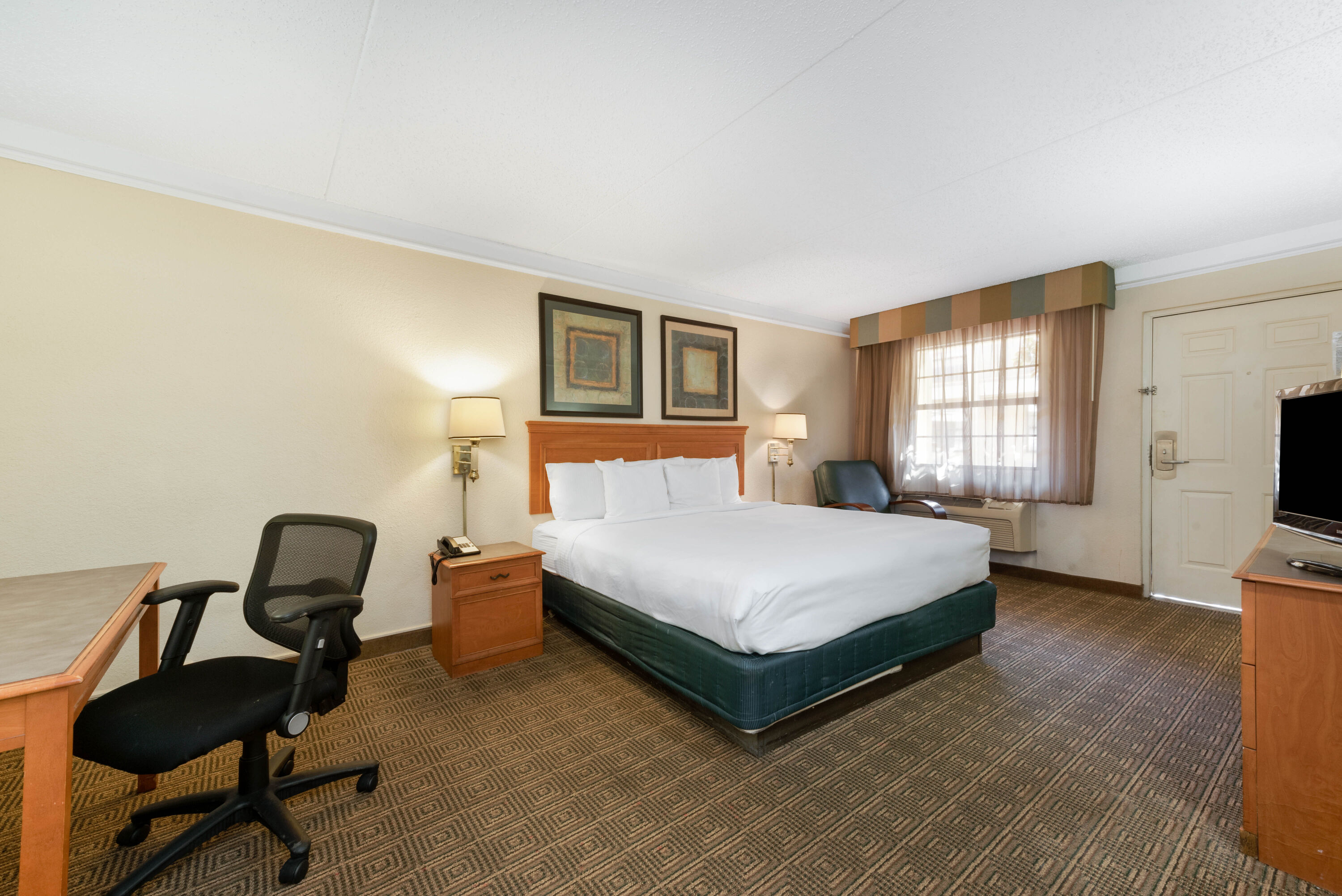 Guest room at the La Quinta Inn by Wyndham Bossier City in Bossier City, Louisiana