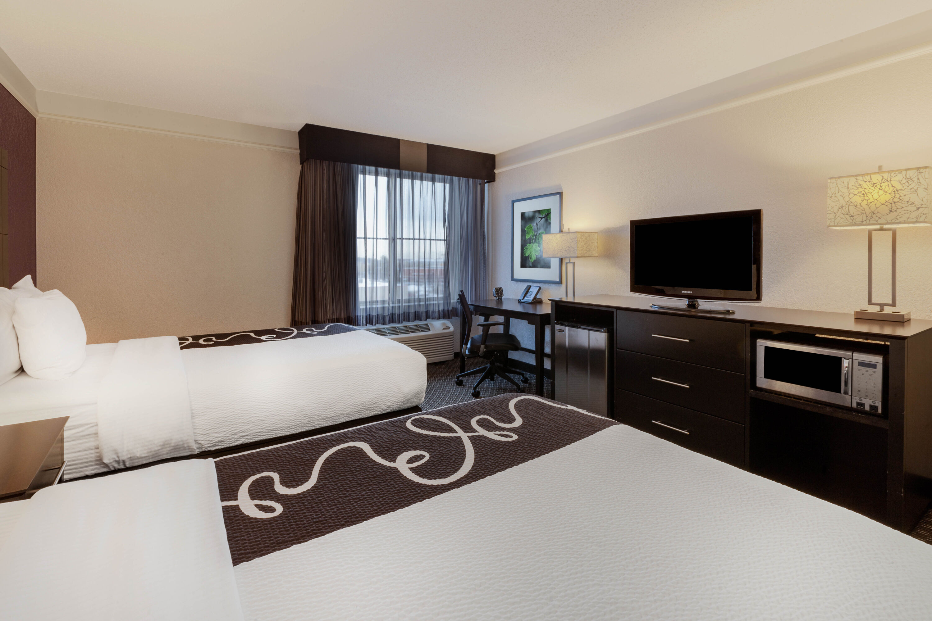 Guest room at the La Quinta Inn & Suites by Wyndham Detroit Utica in Utica, Michigan