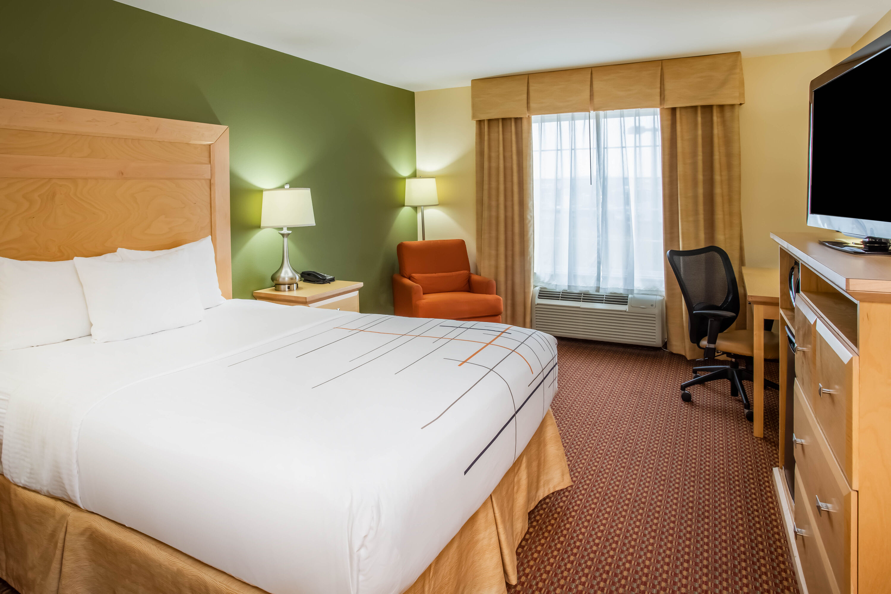 Guest room at the La Quinta Inn & Suites by Wyndham Rochester Mayo Clinic S in Rochester, Minnesota