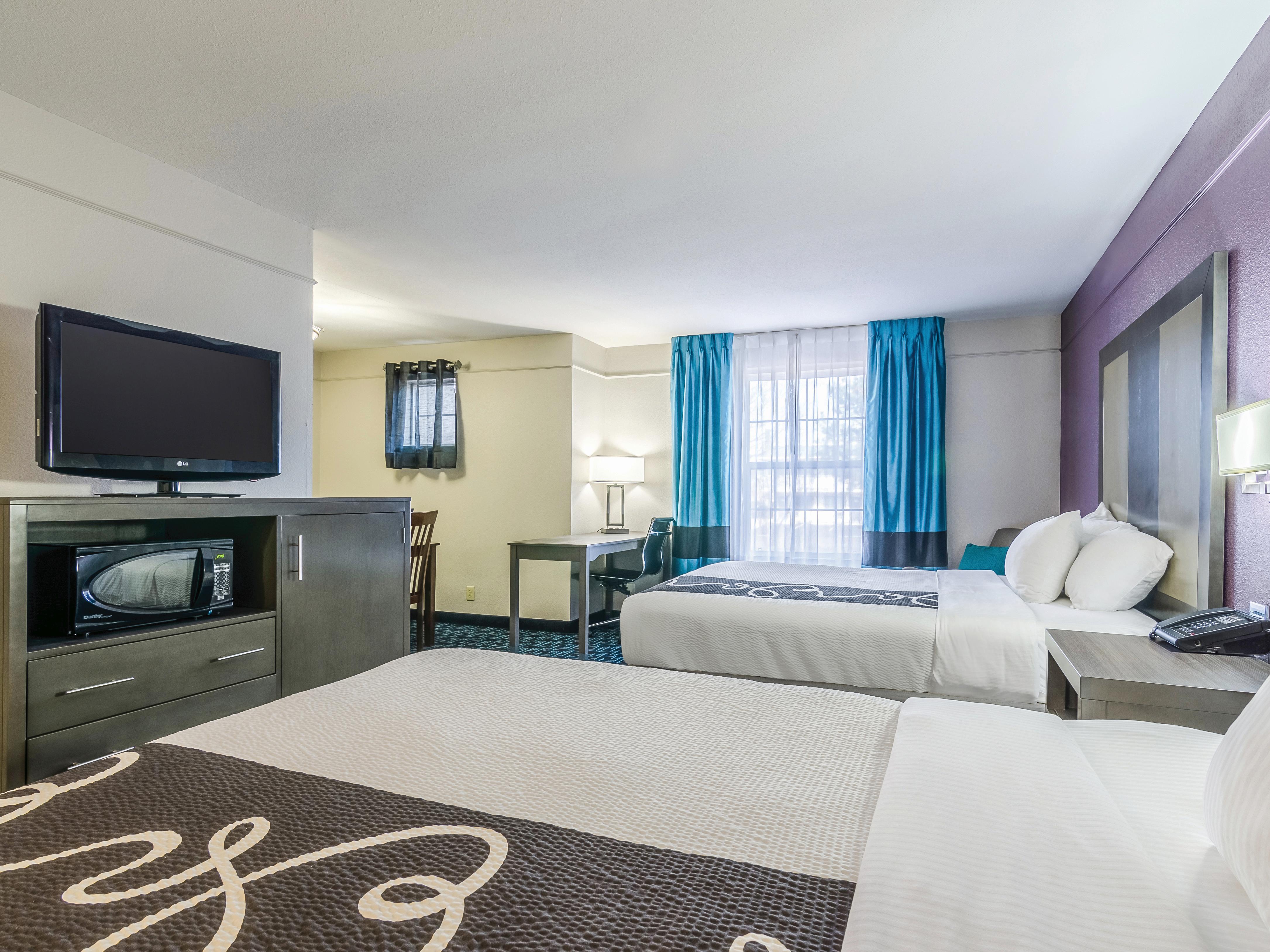 Guest room at the La Quinta Inn & Suites by Wyndham Kansas City Airport in Kansas City, Missouri