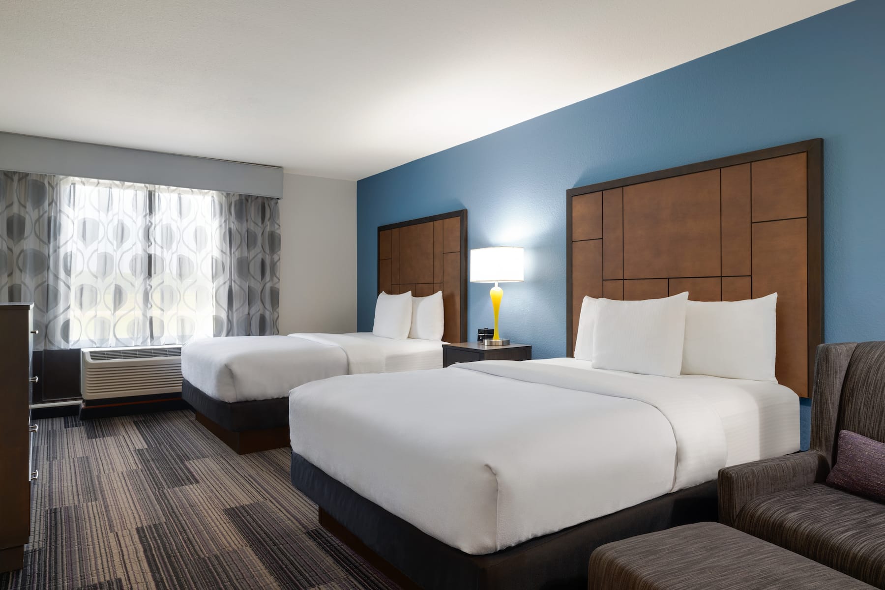 Guest room at the La Quinta Inn & Suites by Wyndham Springfield Airport Plaza in Springfield, Missouri