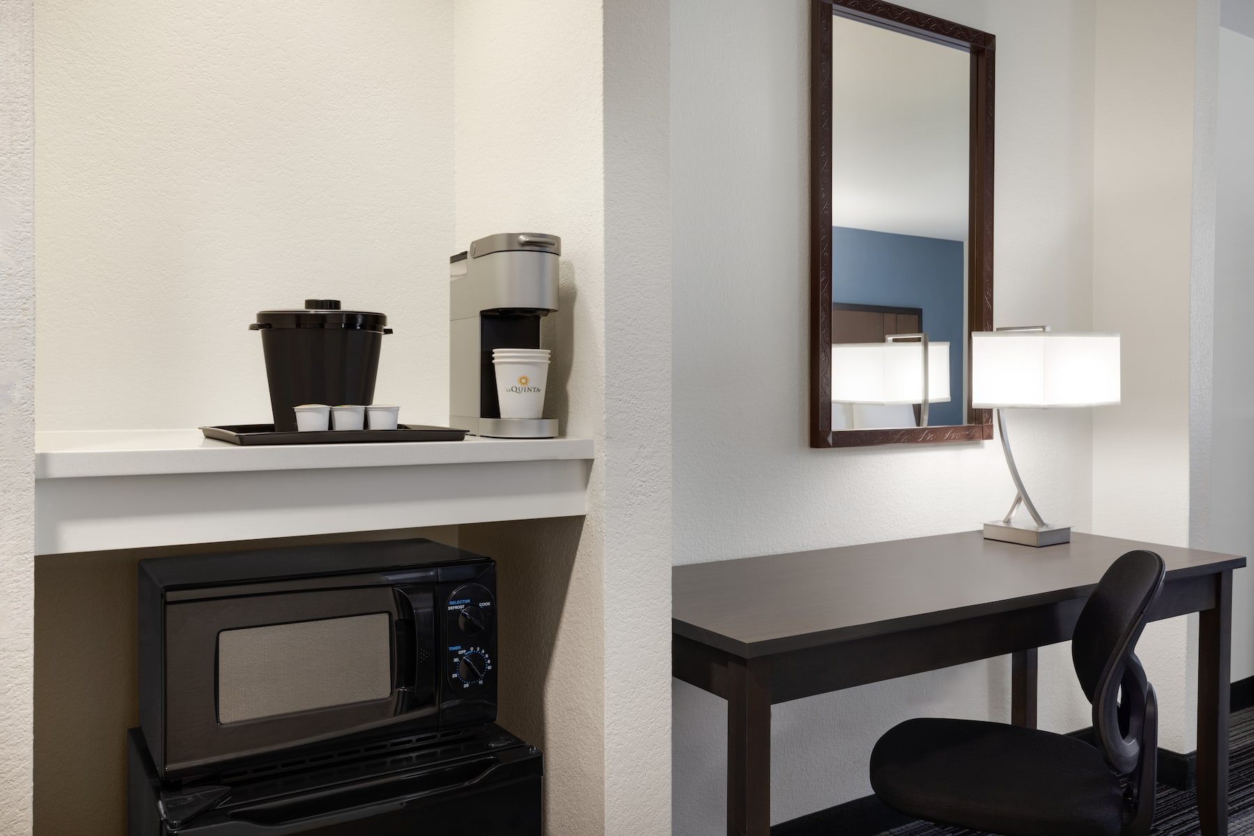 Guest room at the La Quinta Inn & Suites by Wyndham Springfield Airport Plaza in Springfield, Missouri