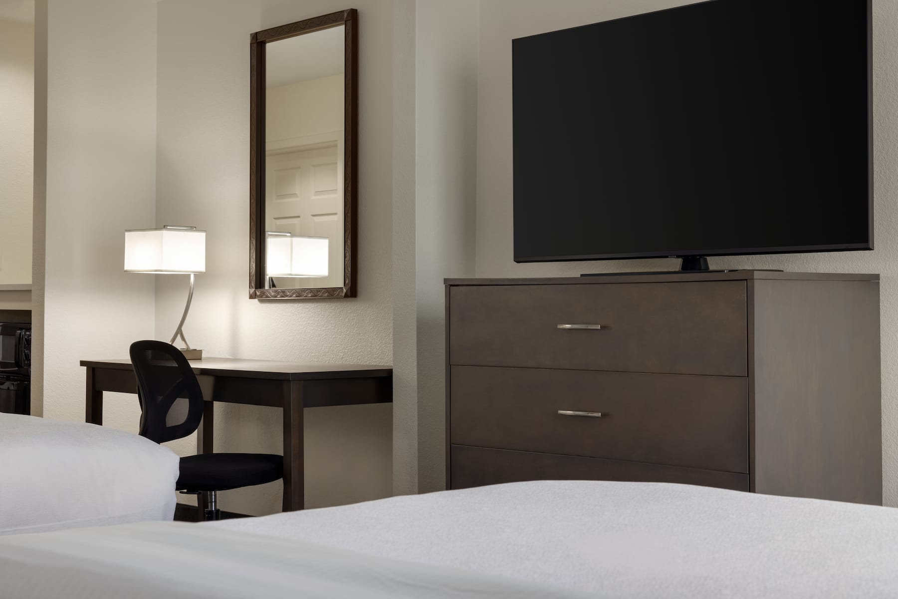 Guest room at the La Quinta Inn & Suites by Wyndham Springfield Airport Plaza in Springfield, Missouri