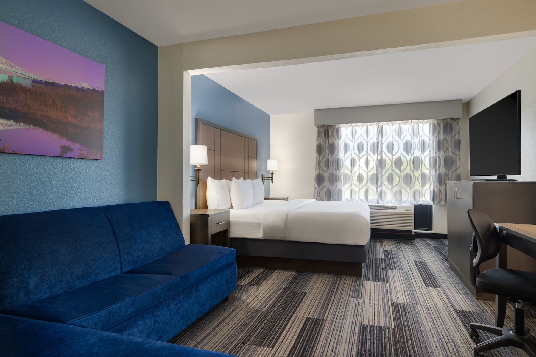 Guest room at the La Quinta Inn & Suites by Wyndham Springfield Airport Plaza in Springfield, Missouri