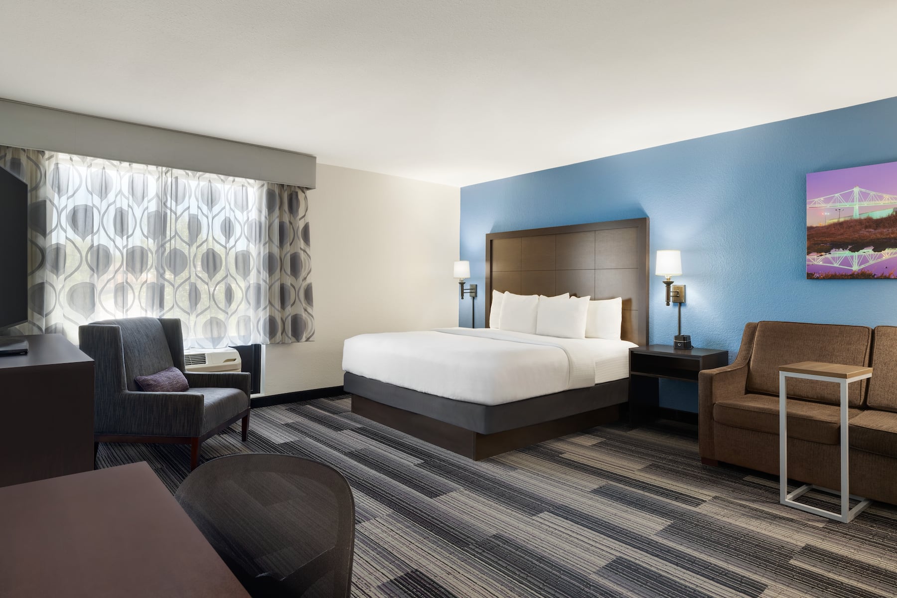 Guest room at the La Quinta Inn & Suites by Wyndham Springfield Airport Plaza in Springfield, Missouri