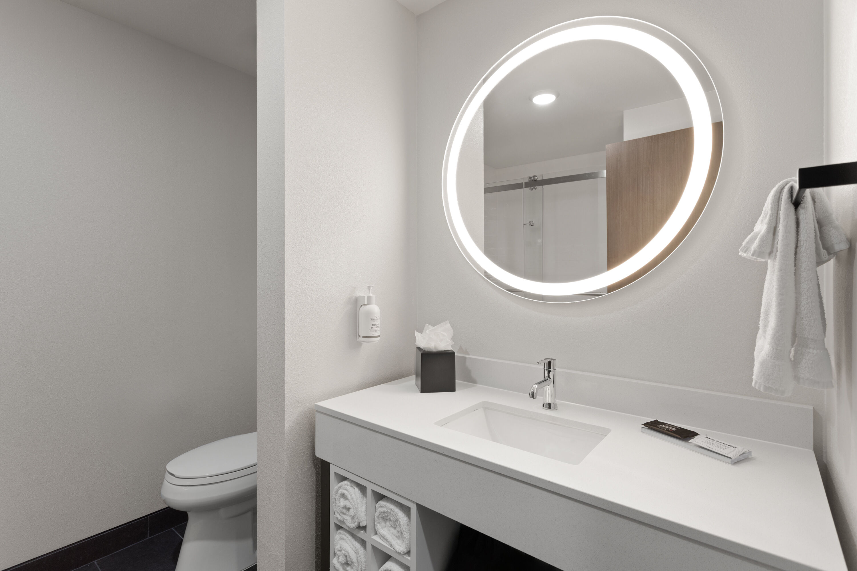 Guest room bath at the La Quinta Inn & Suites by Wyndham Olive Branch in Olive Branch, Mississippi