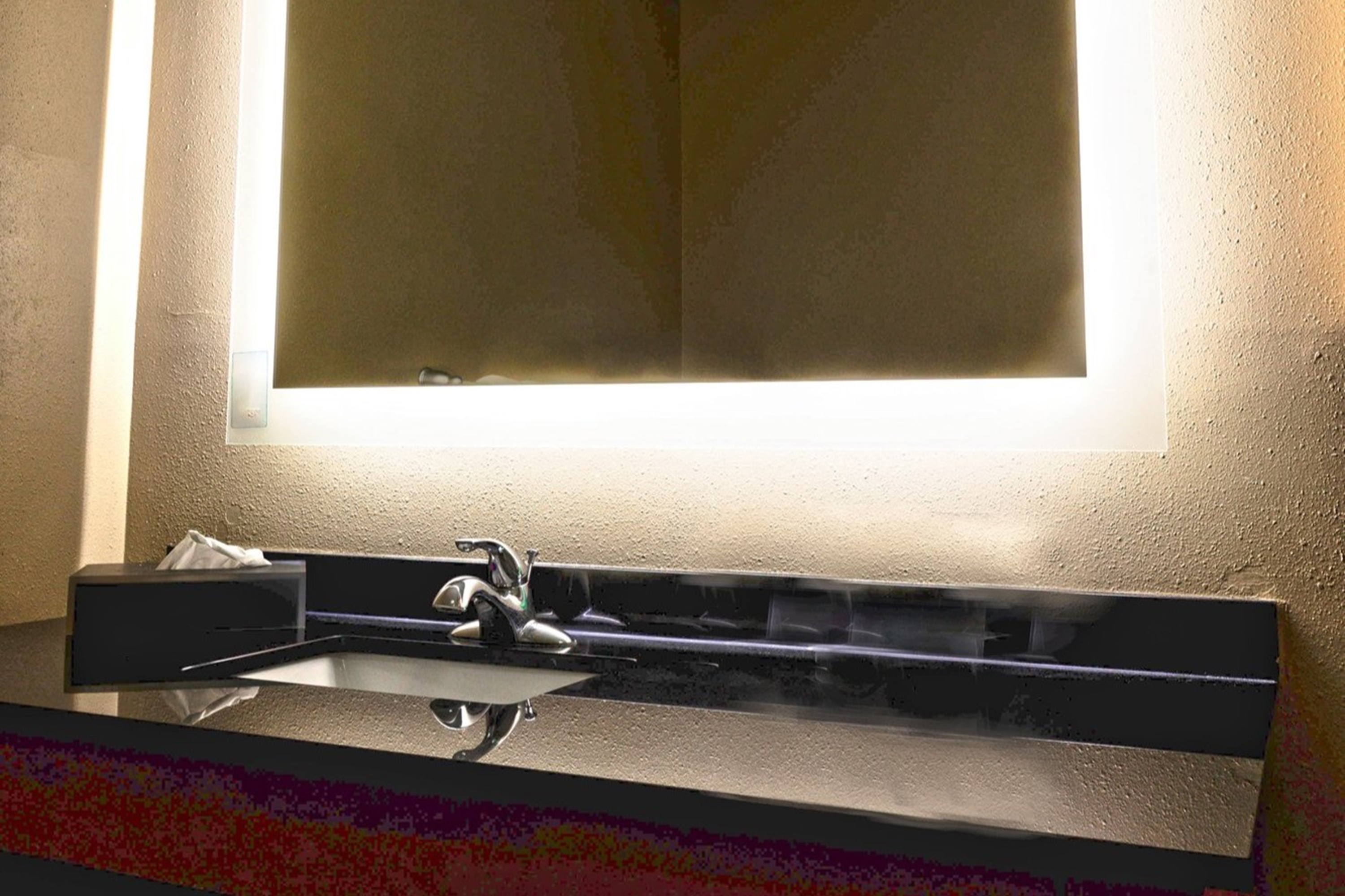 Guest room bath at the La Quinta Inn & Suites by Wyndham Starkville at MSU in Starkville, Mississippi