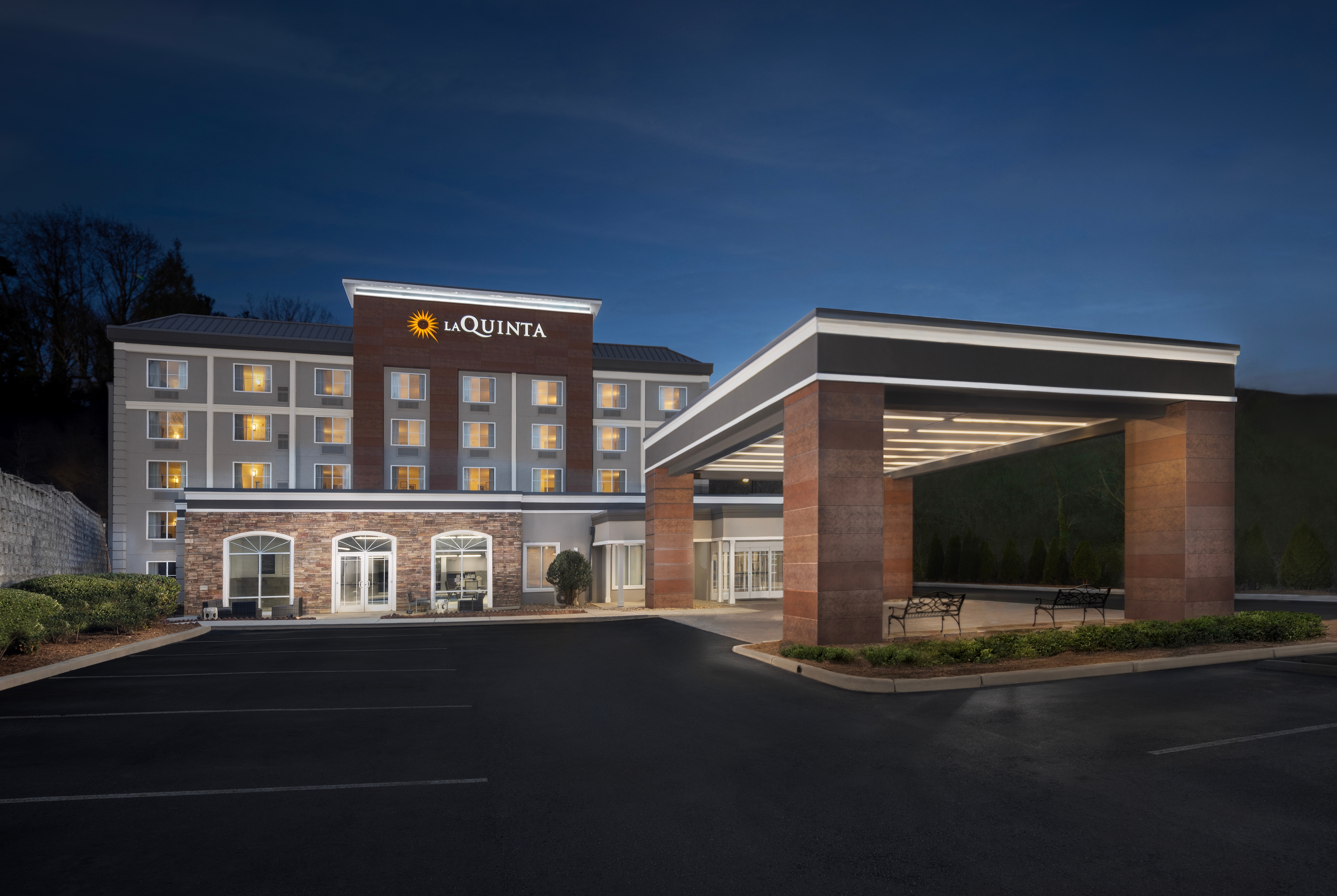 Exterior Night Image of La Quinta Inn & Suites by Wyndham Asheville Downtown hotel in Asheville, North Carolina
