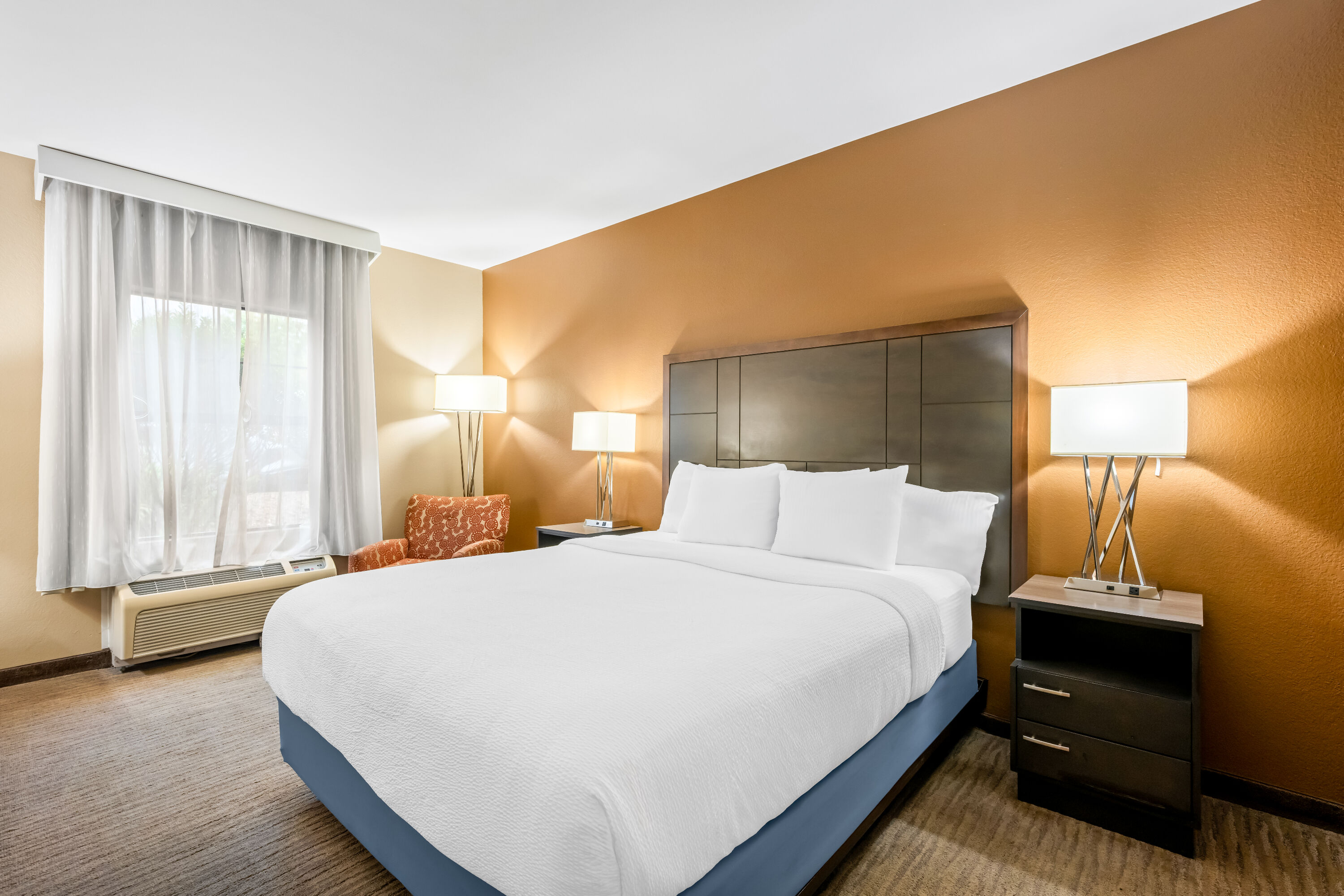 King bed guest room at the La Quinta Inn & Suites by Wyndham Boone University in Boone, North Carolina