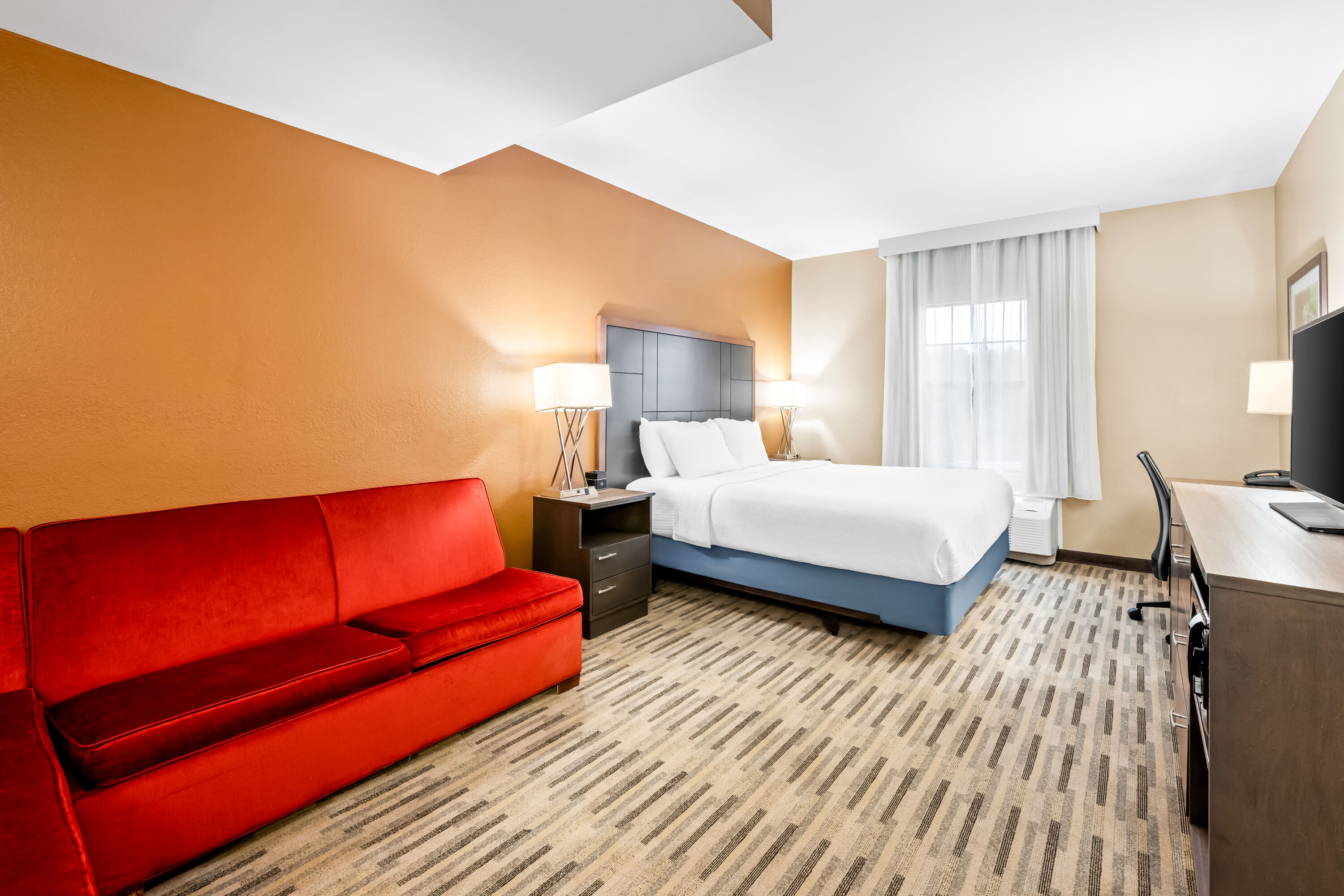 King bed guest room at the La Quinta Inn & Suites by Wyndham Boone University in Boone, North Carolina