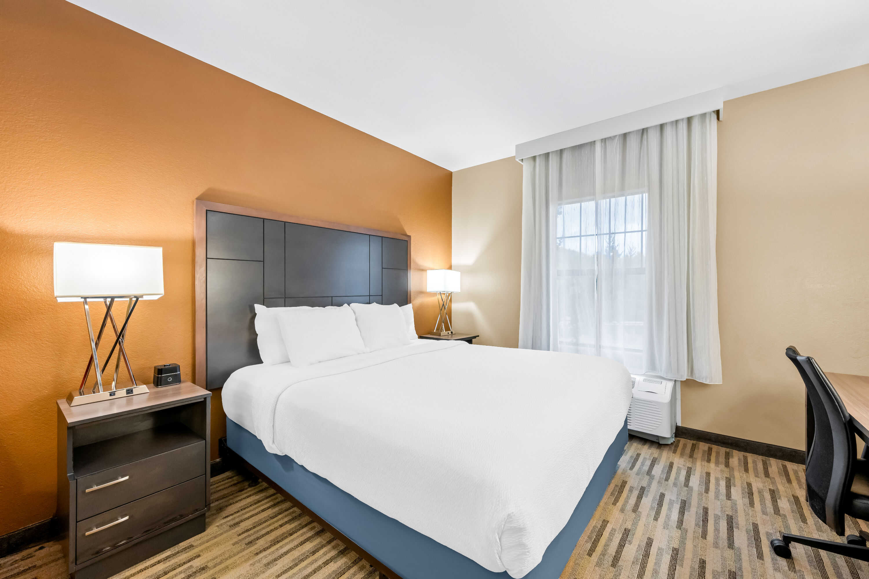 King bed guest room at the La Quinta Inn & Suites by Wyndham Boone University in Boone, North Carolina