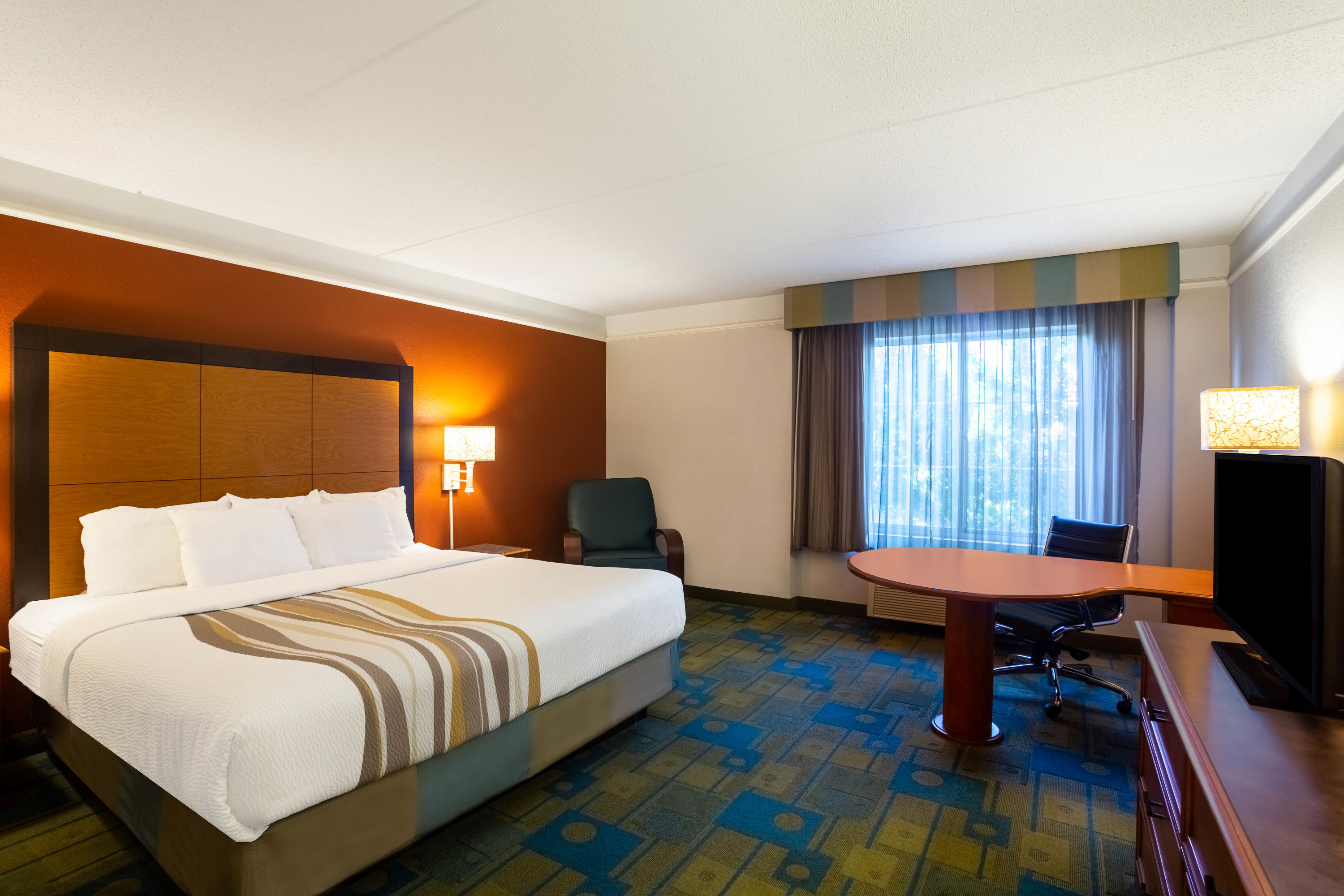 Guest room at the La Quinta Inn & Suites by Wyndham Charlotte Airport South in Charlotte, North Carolina