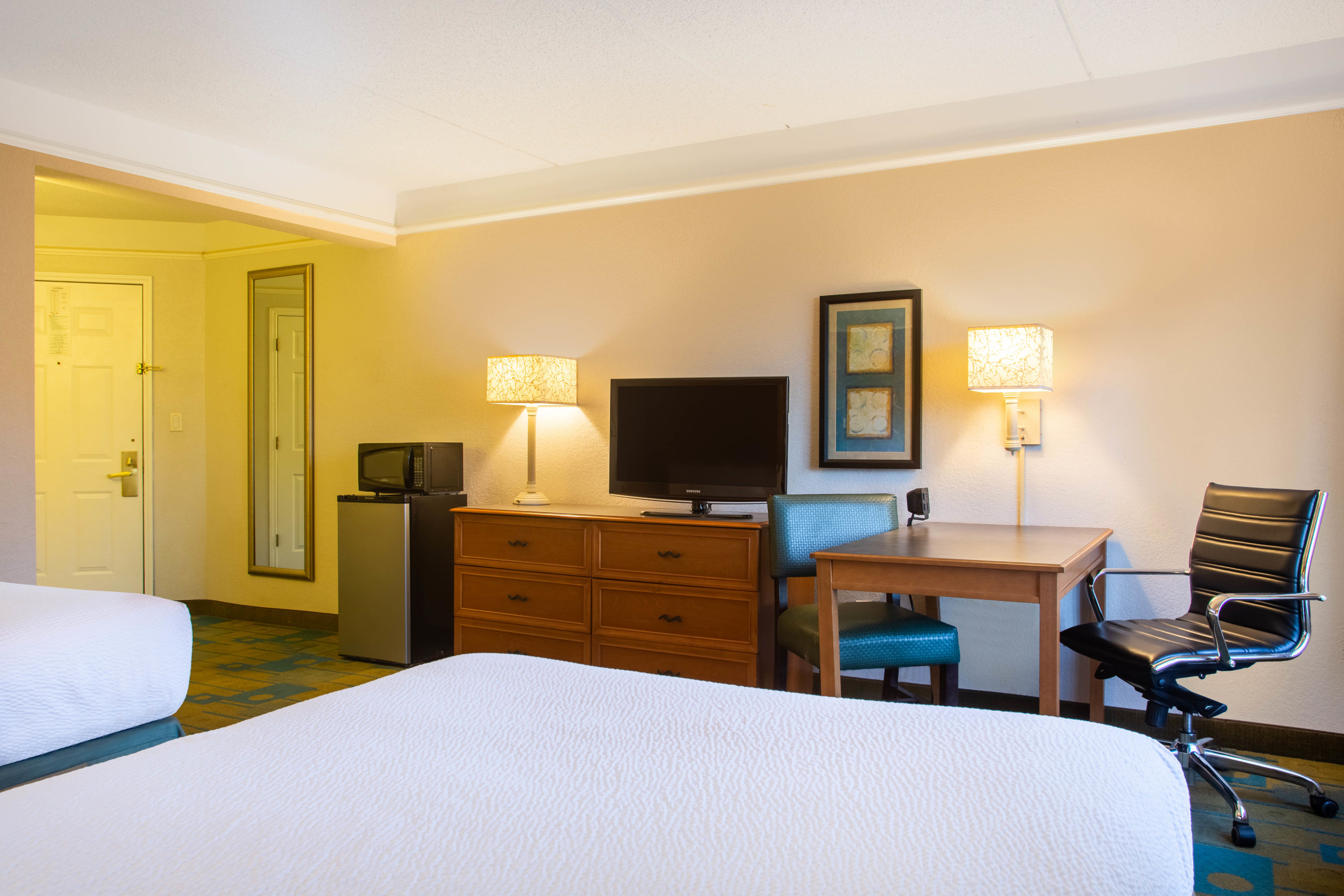 Guest room at the La Quinta Inn & Suites by Wyndham Charlotte Airport South in Charlotte, North Carolina