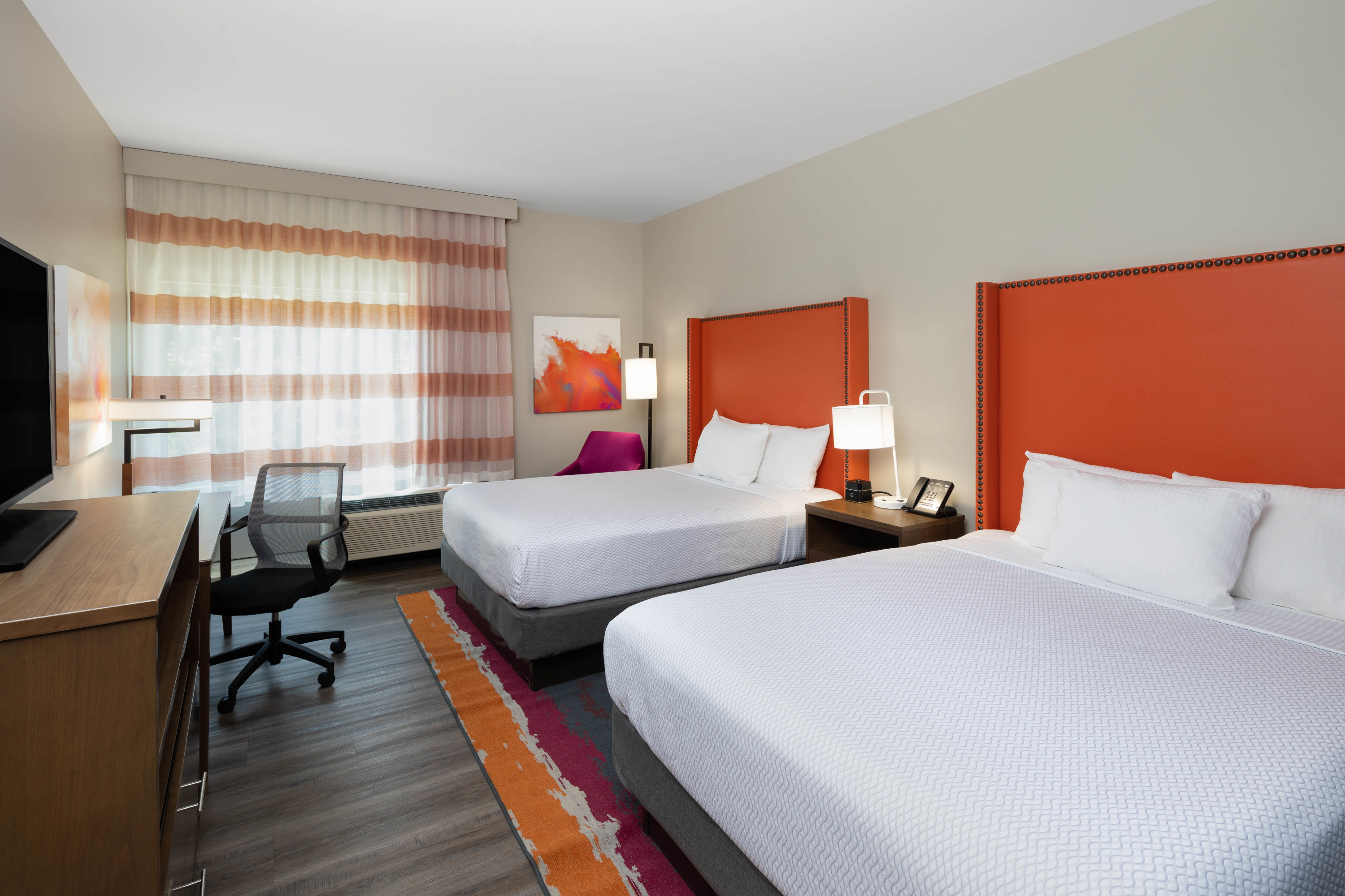 Guest room at the La Quinta Inn & Suites by Wyndham Greensboro Arpt High Point in Greensboro, North Carolina