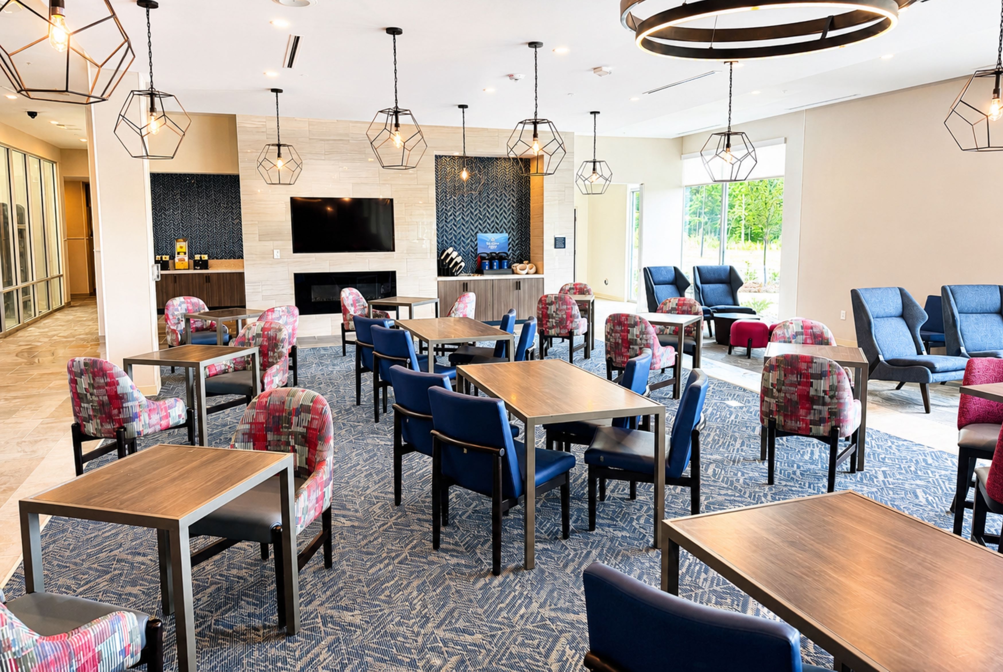 La Quinta Inn & Suites by Wyndham Mebane restaurant breakfast area with seating in Mebane, North Carolina