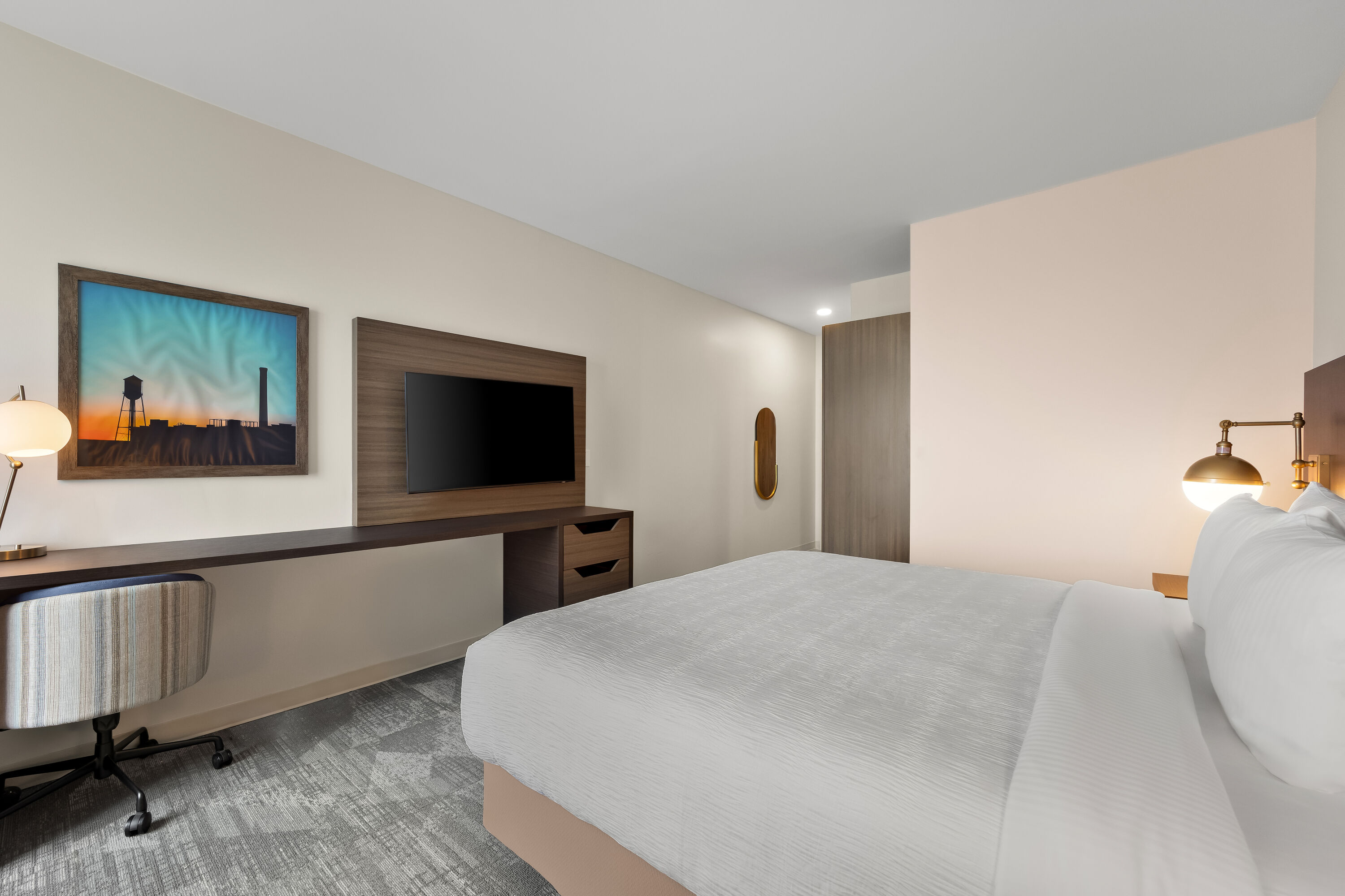King bed guest room at the La Quinta Inn & Suites by Wyndham Mebane in Mebane, North Carolina